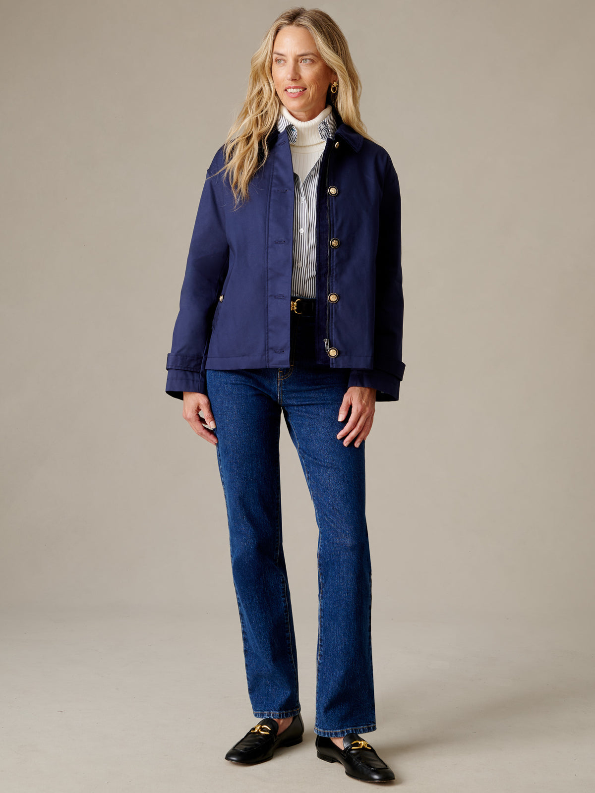 J.McLaughlin Brantley Jacket in navy worn with a white sweater, jeans, and black loafers for a polished timeless look