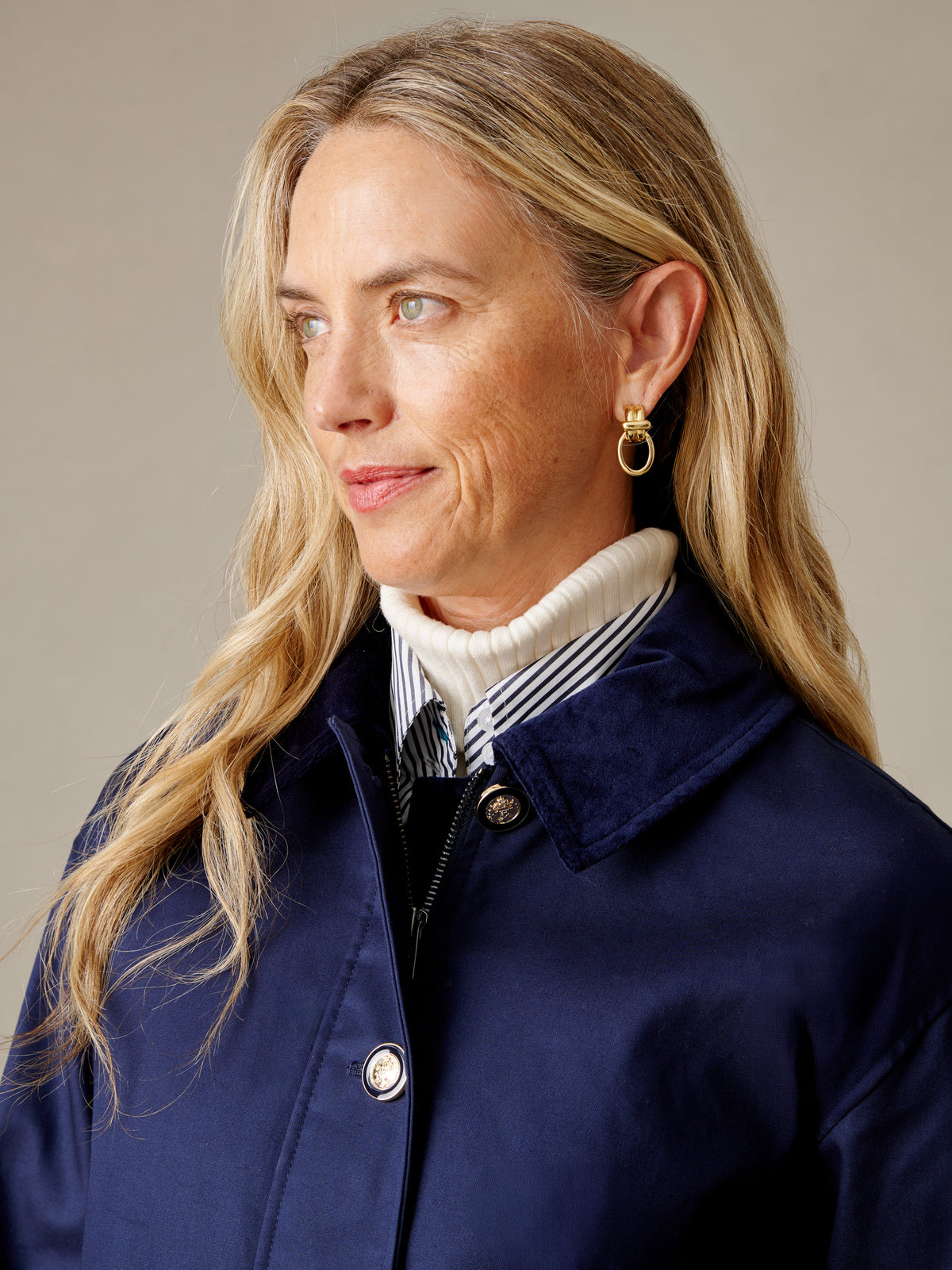 J.McLaughlin Brantley Jacket in navy worn by a woman over a striped shirt and cream turtleneck for timeless everyday style