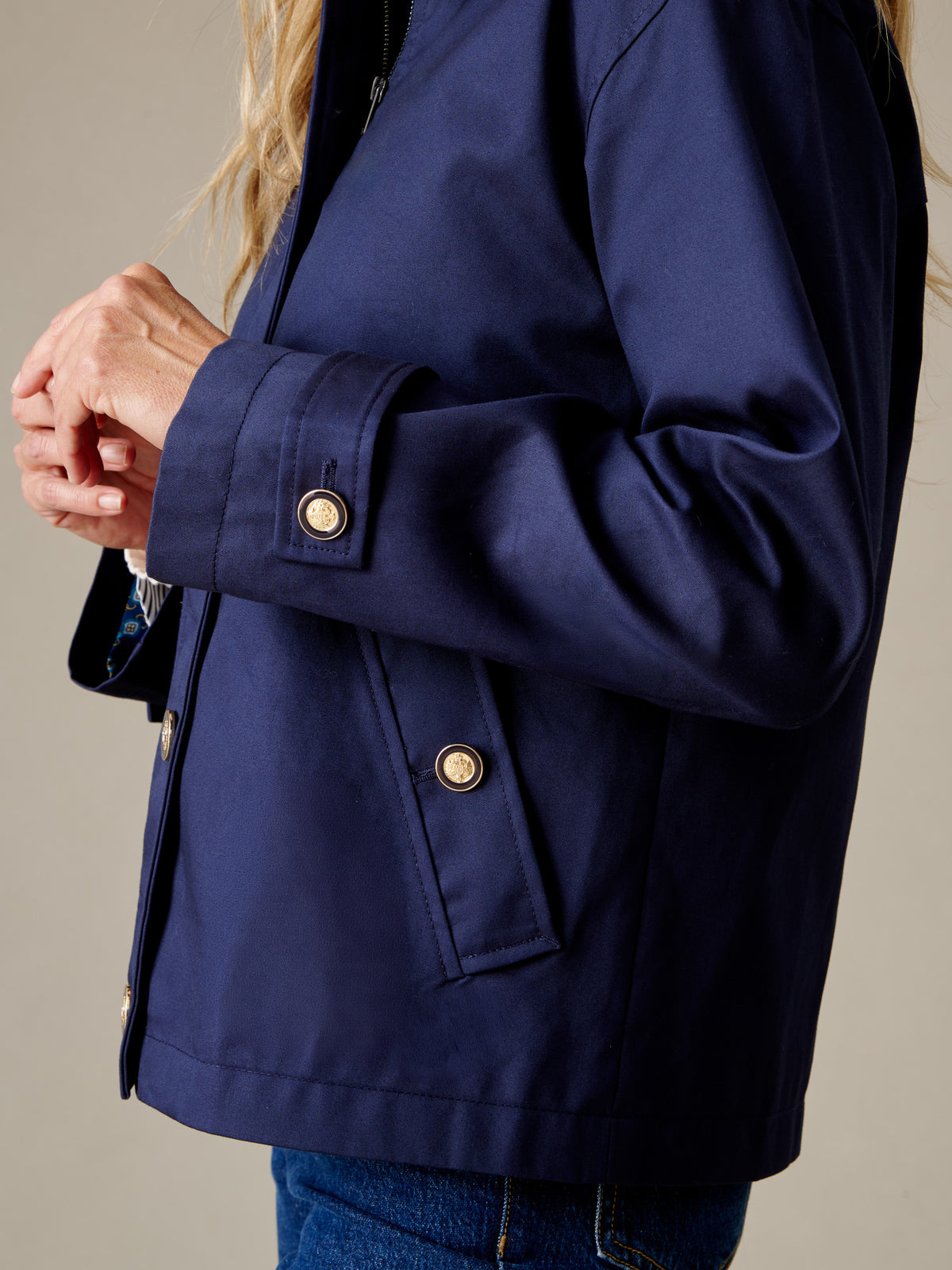 J.McLaughlin Brantley Jacket in navy with buttoned cuffs and front pockets worn over blue jeans