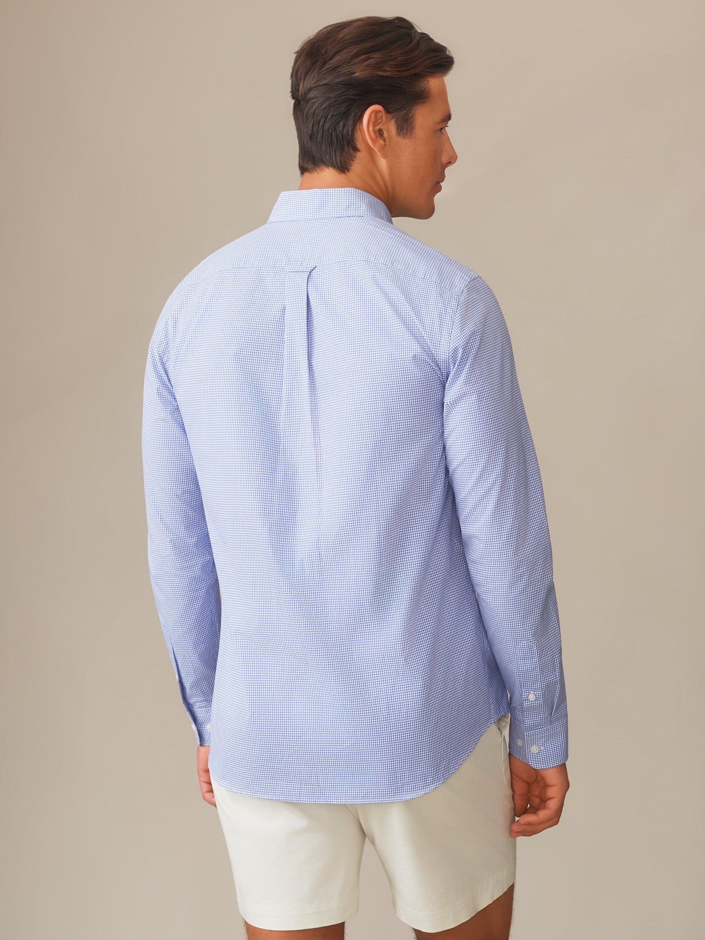 Man wearing a Belvedere Cotton Shirt in Graphic Check by J.McLaughlin, showcasing effortlessly stylish, enduring designs and innovative fabrics for a legacy of timeless fashion. A destination for defining style. Life, Well-Lived.