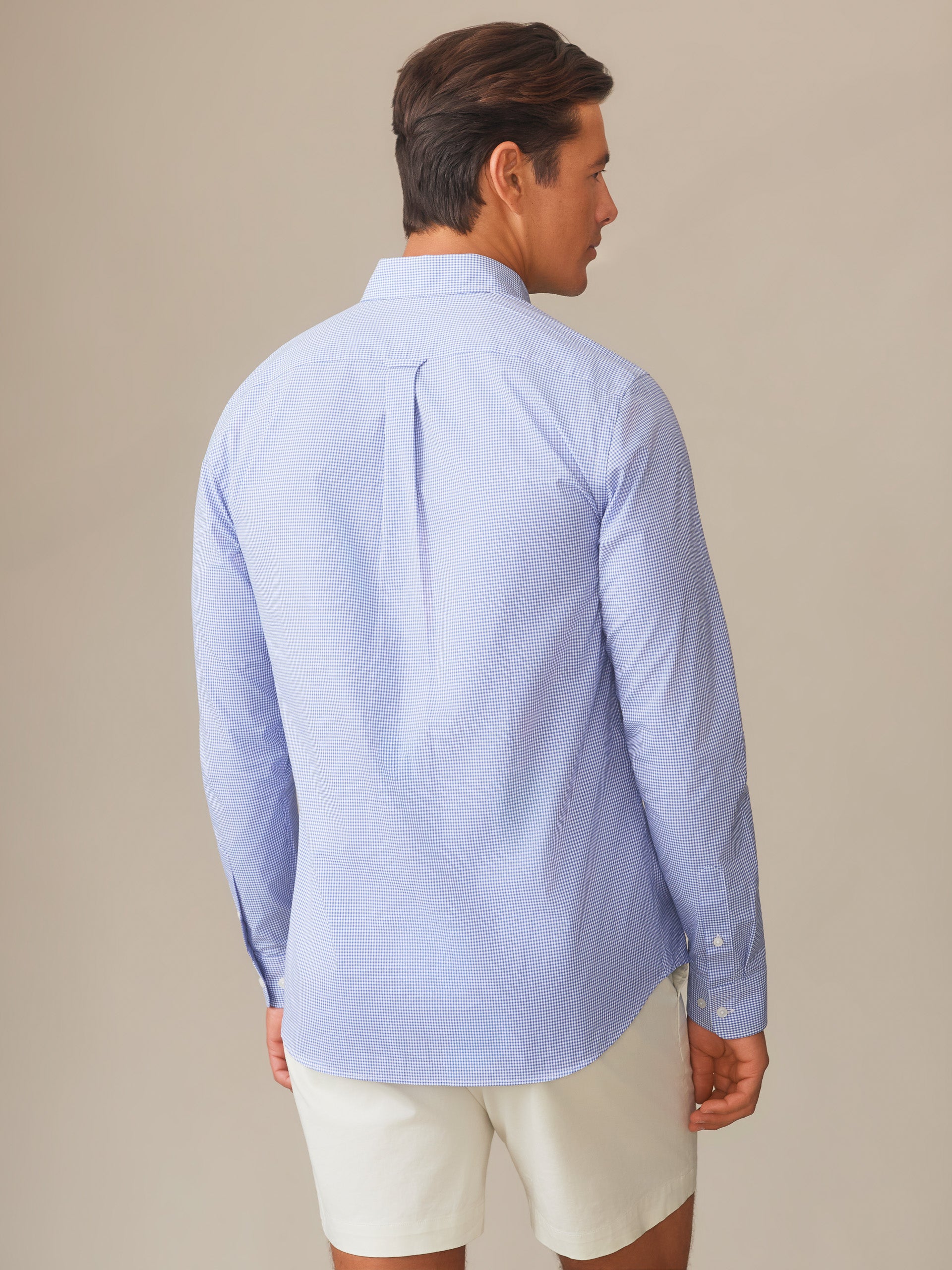 Man wearing a Belvedere Cotton Shirt in Graphic Check by J.McLaughlin, showcasing effortlessly stylish, enduring designs and innovative fabrics for a legacy of timeless fashion. A destination for defining style. Life, Well-Lived.