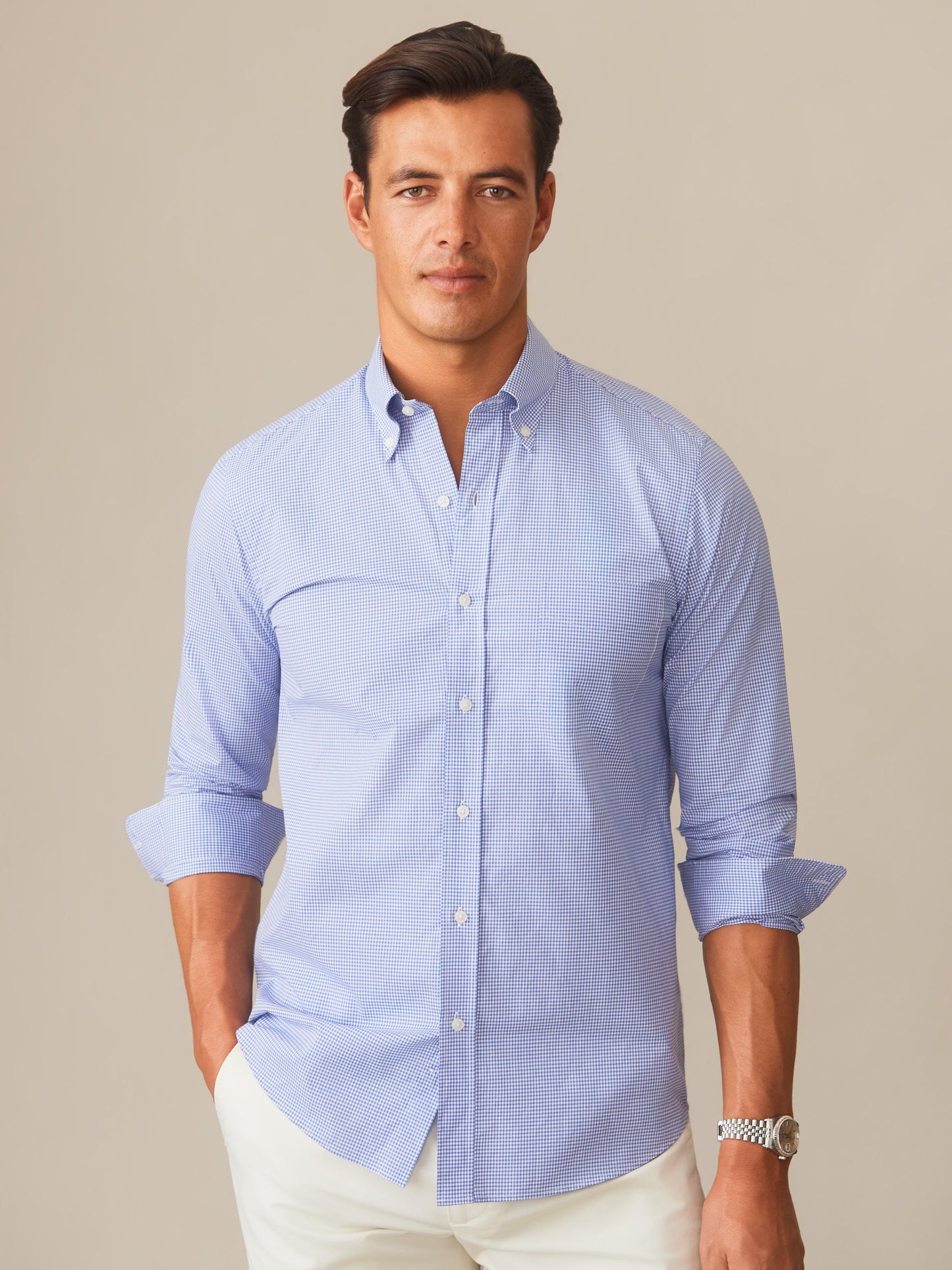 Man wearing a Belvedere Cotton Shirt in Graphic Check by J.McLaughlin, featuring effortlessly stylish design in a classic blue check pattern, embodying enduring designs with innovative fabrics for a legacy of timeless fashion. A destination for defining style. Life, Well-Lived.