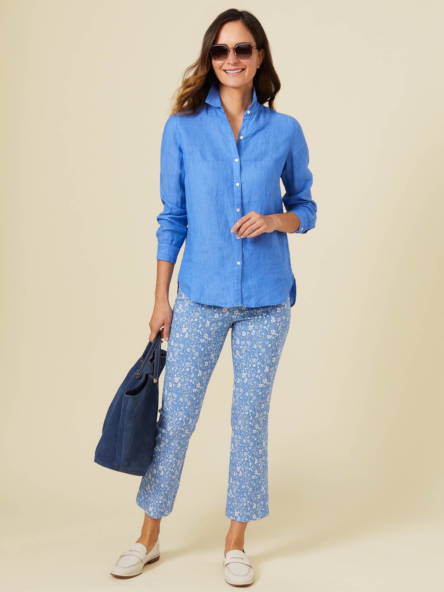 Model wearing J.McLaughlin Britt shirt in french blue made with linen.