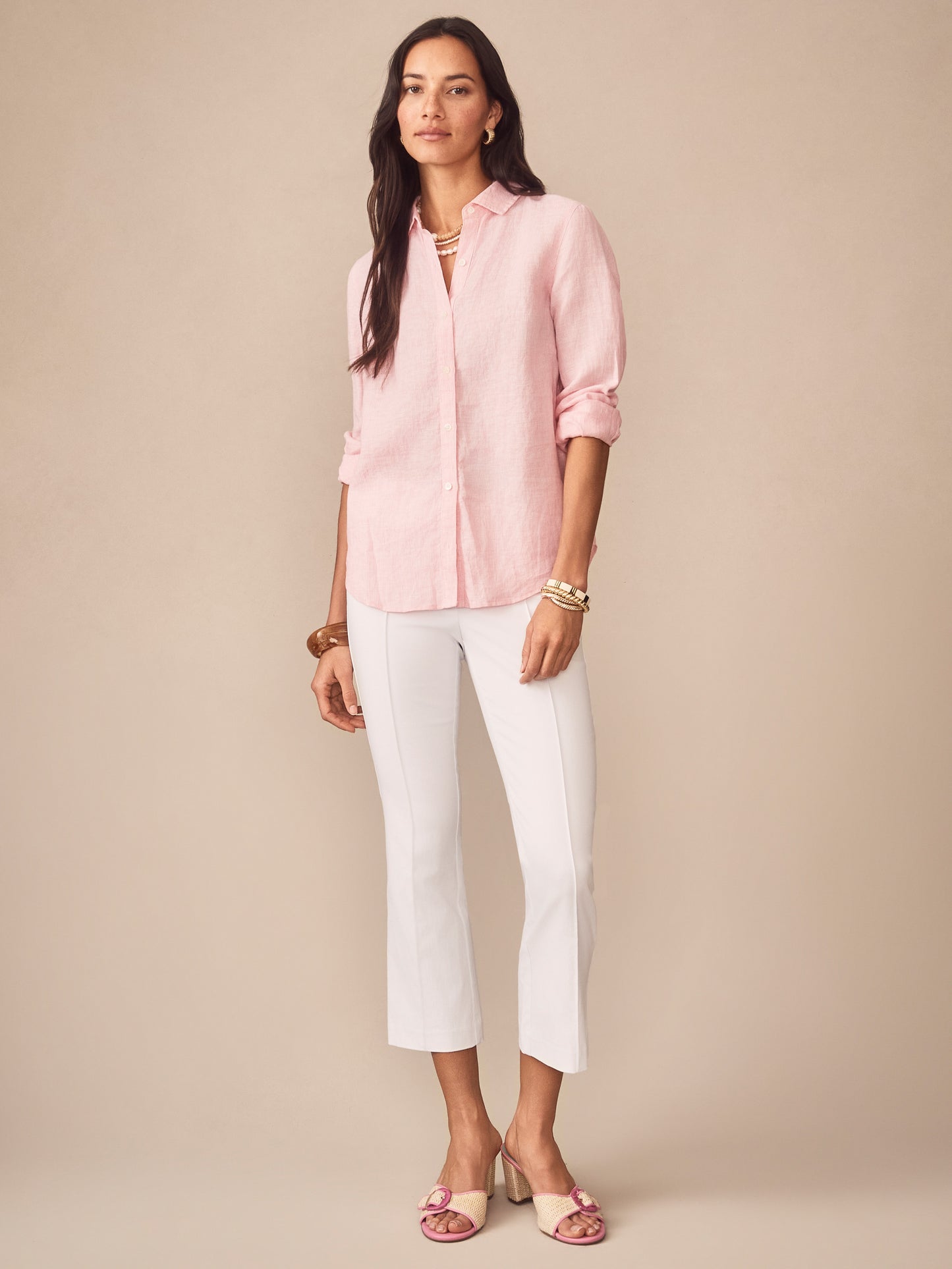 Model wearing J.McLaughlin Britt linen shirt in pink/white made with linen.
