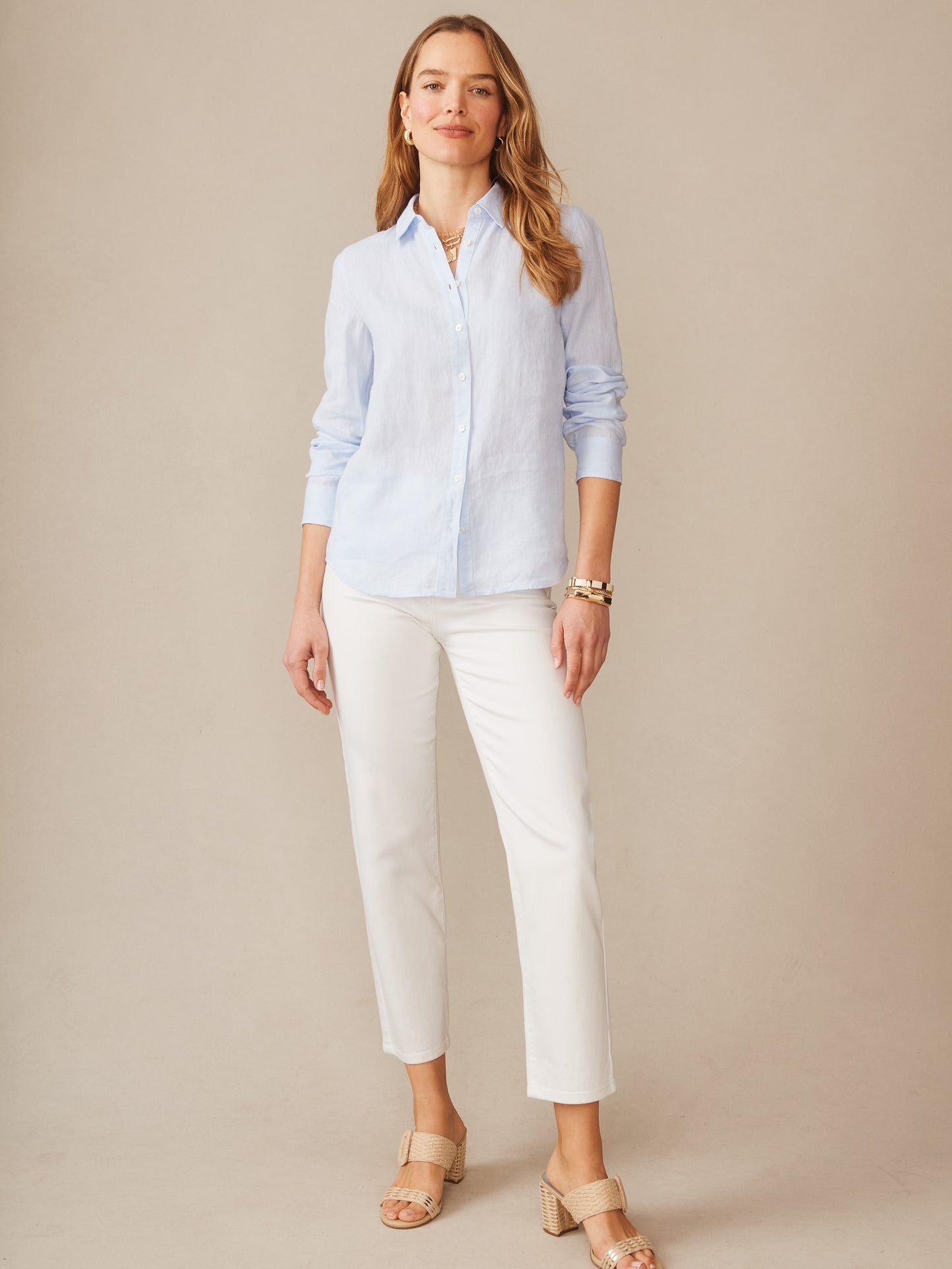 Model wearing J.McLaughlin Britt shirt in sky blue made with linen.