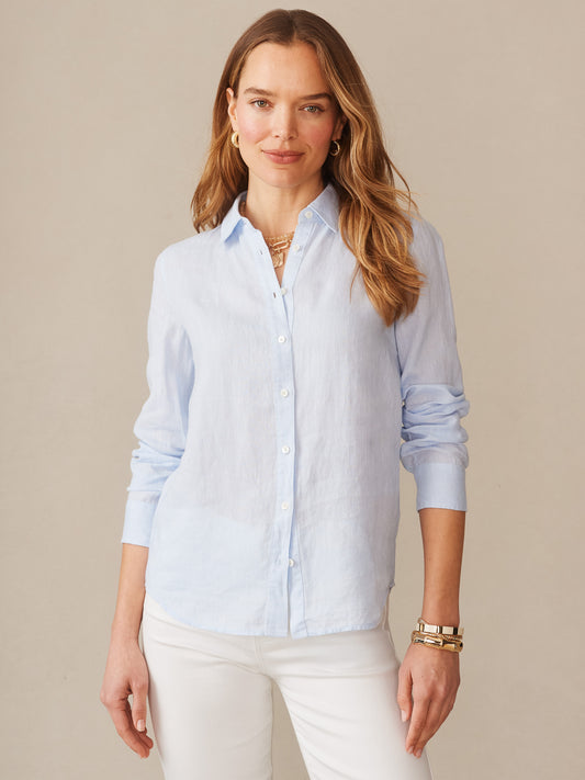 Model wearing J.McLaughlin Britt shirt in sky blue made with linen.
