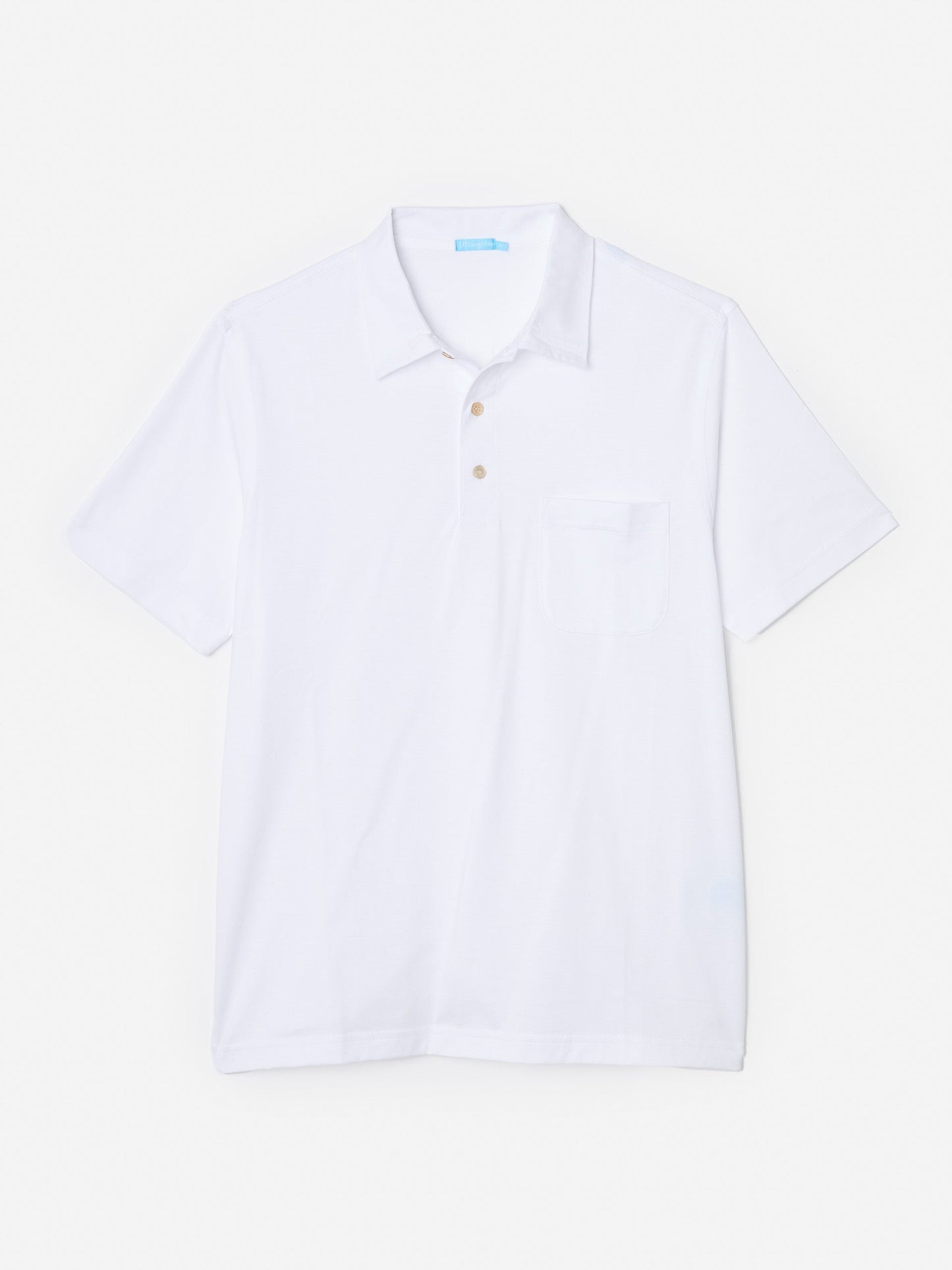 Model wearing J.McLaughlin Callahan polo in white made with cotton.