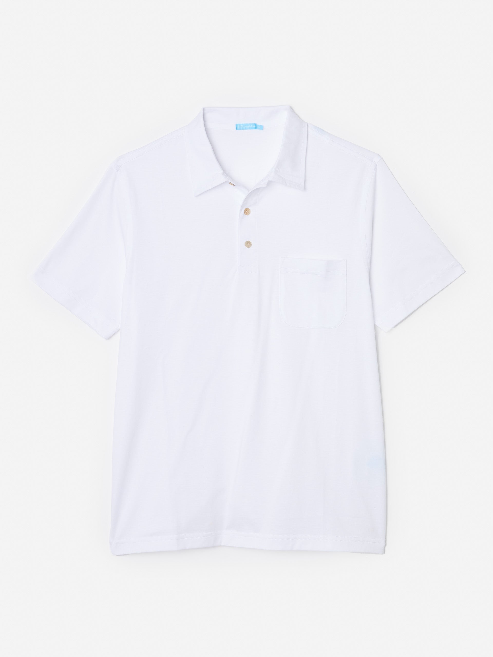 Model wearing J.McLaughlin Callahan polo in white made with cotton.