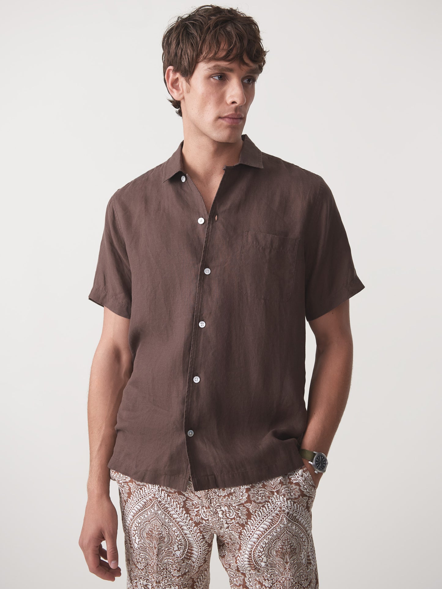 Model wearing J.McLaughlin Irons shirt in brown made with linen.