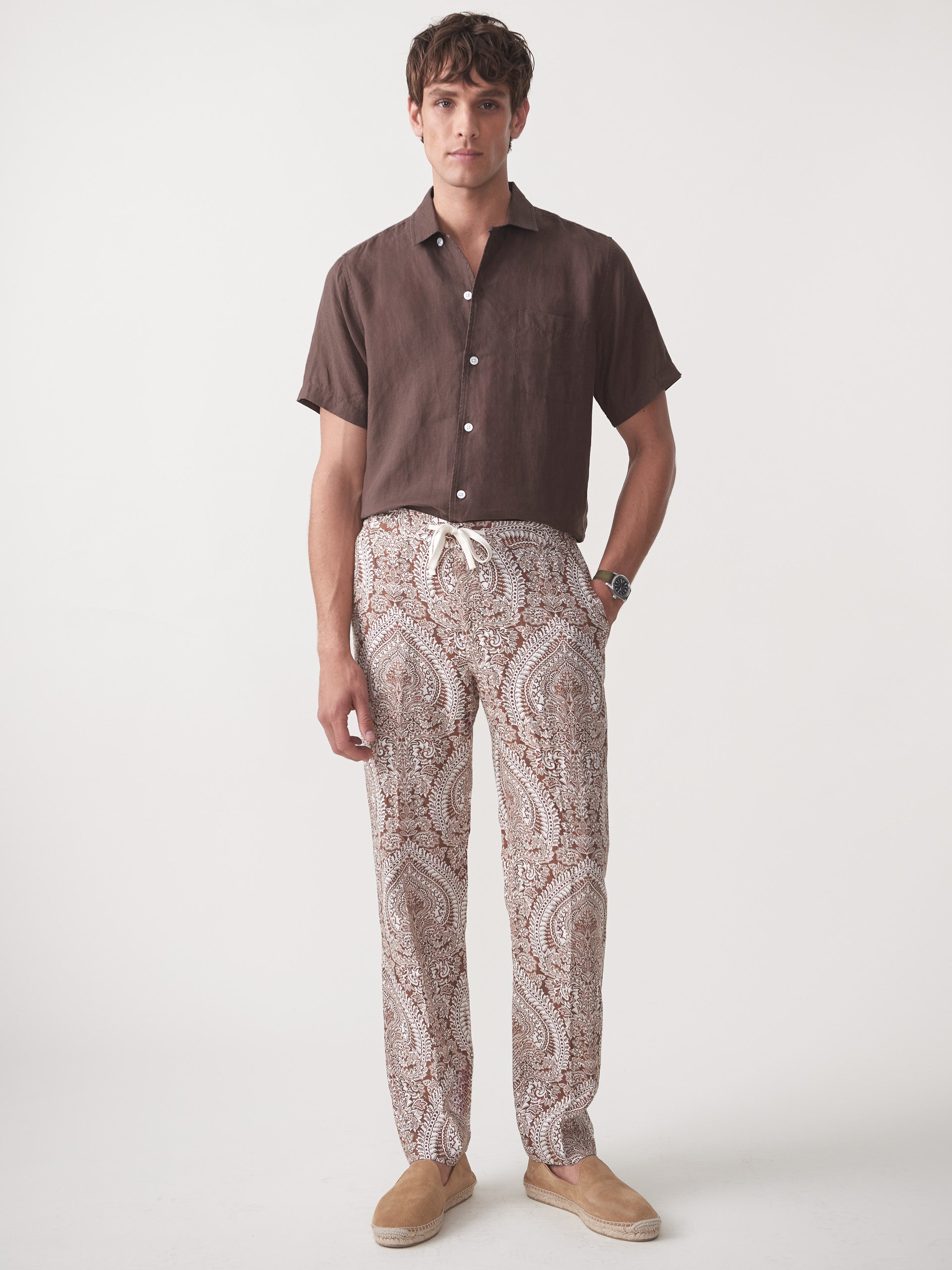 Model wearing J.McLaughlin Callister pants in off white/brown made with linen.