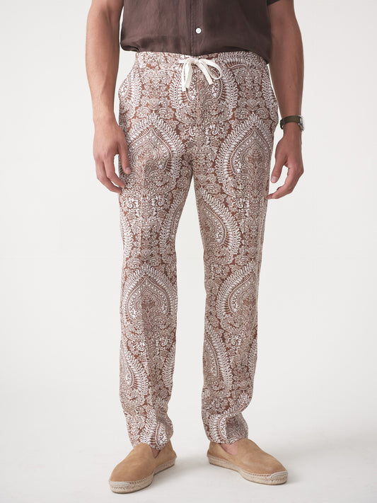 Model wearing J.McLaughlin Callister pants in off white/brown made with linen.