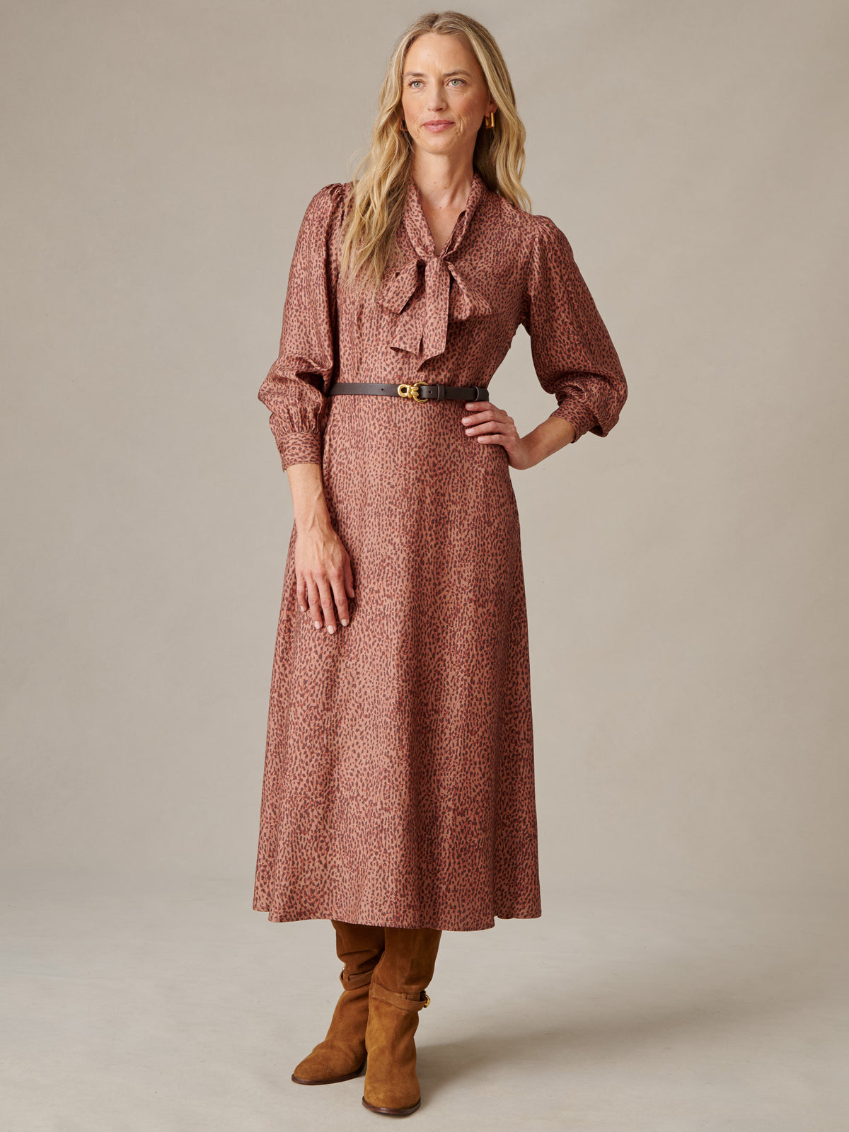 Cally Silk Blend Dress in Leopardette with tied scarf neckline blouson sleeves and belted waist styled with tall boots by J.McLaughlin