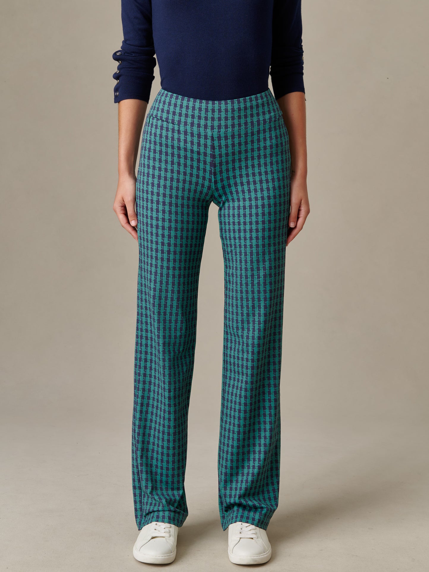 Front view of a person wearing Carmel Pants in Algiers Check by J.McLaughlin, styled with a navy top and white sneakers, showcasing an effortlessly stylish and enduring design.
