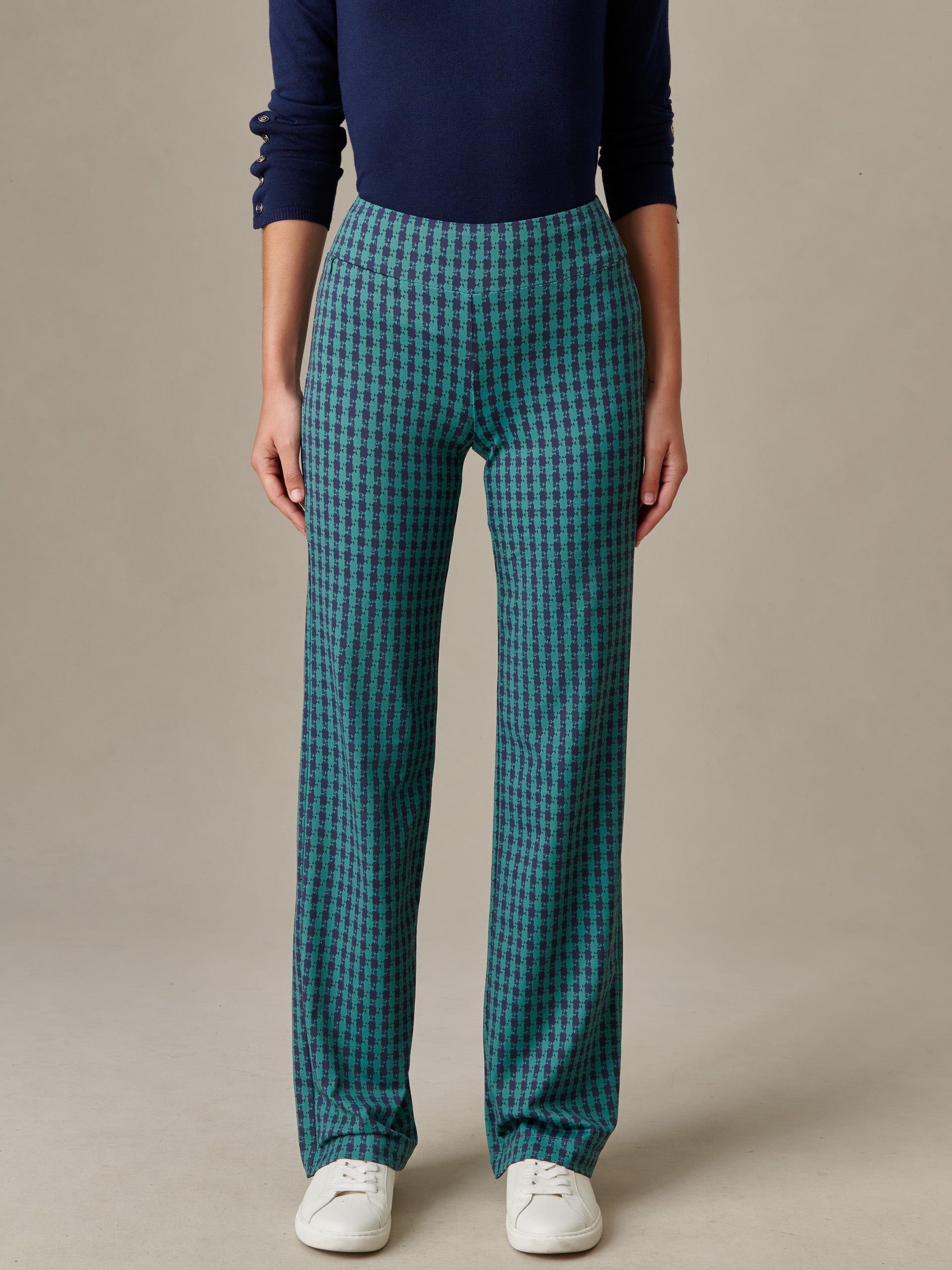 Front view of a person wearing Carmel Pants in Algiers Check by J.McLaughlin, styled with a navy top and white sneakers, showcasing an effortlessly stylish and enduring design.