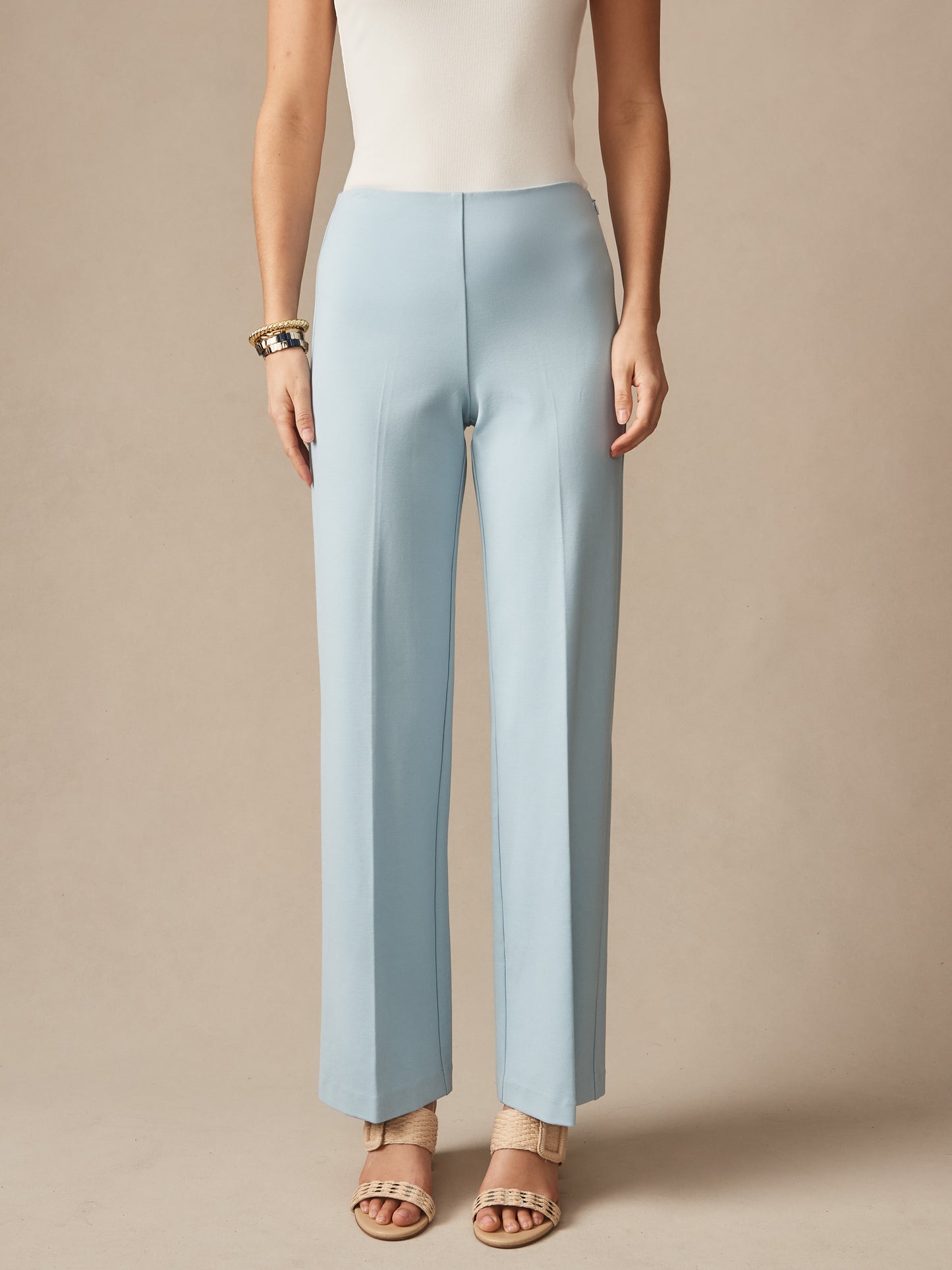 A pair of sky blue Carter Pants by J.McLaughlin, designed with innovative fabrics for enduring style and impeccable craftsmanship, perfect for a destination for defining style. Life, Well-Lived.