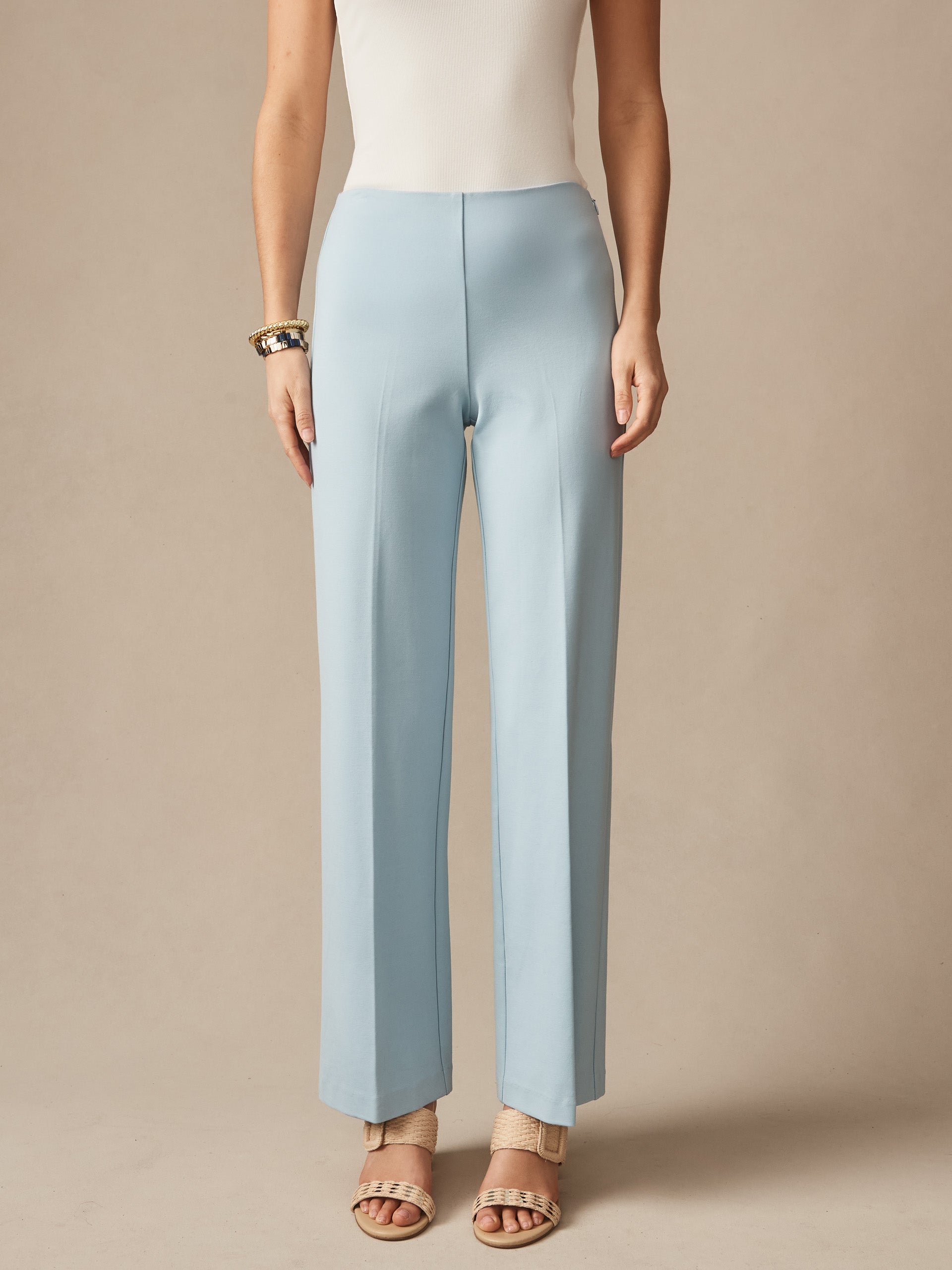A pair of sky blue Carter Pants by J.McLaughlin, designed with innovative fabrics for enduring style and impeccable craftsmanship, perfect for a destination for defining style. Life, Well-Lived.