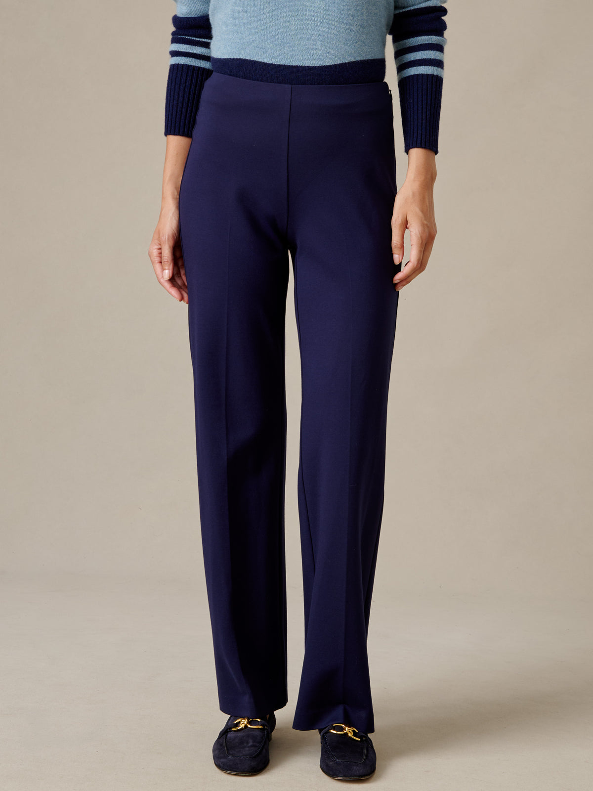 J.McLaughlin Carter Pants in navy featuring a fluid wide leg silhouette and refined knit construction styled with a striped sweater and loafers