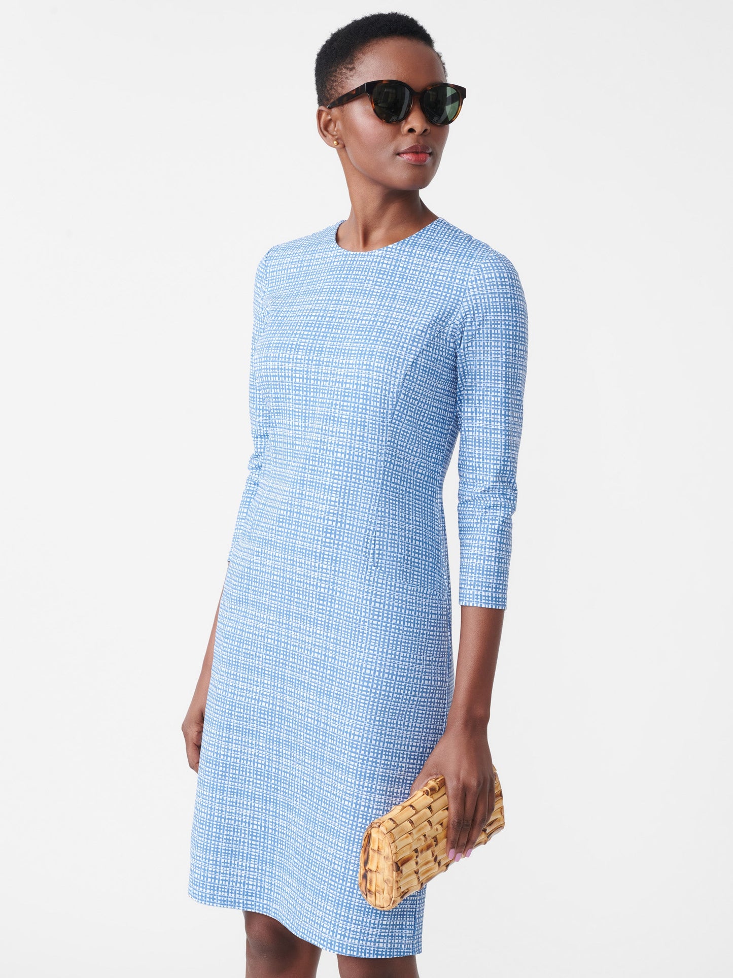 Model wearing J.McLaughlin Catalyst dress in blue/cream made with Catalina cloth.