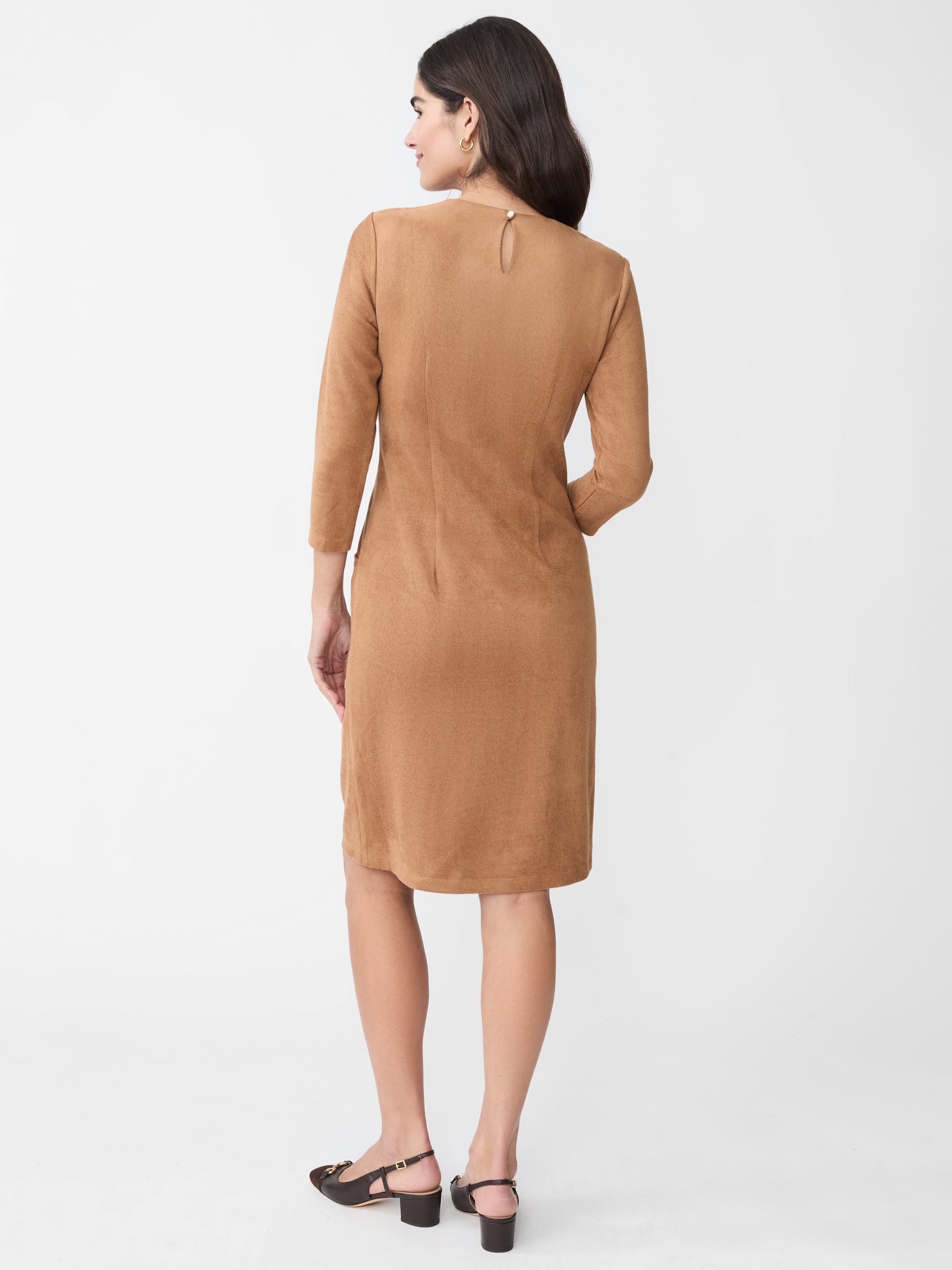 Model wearing J.McLaughlin Catalyst dress in tan made with faux suede.