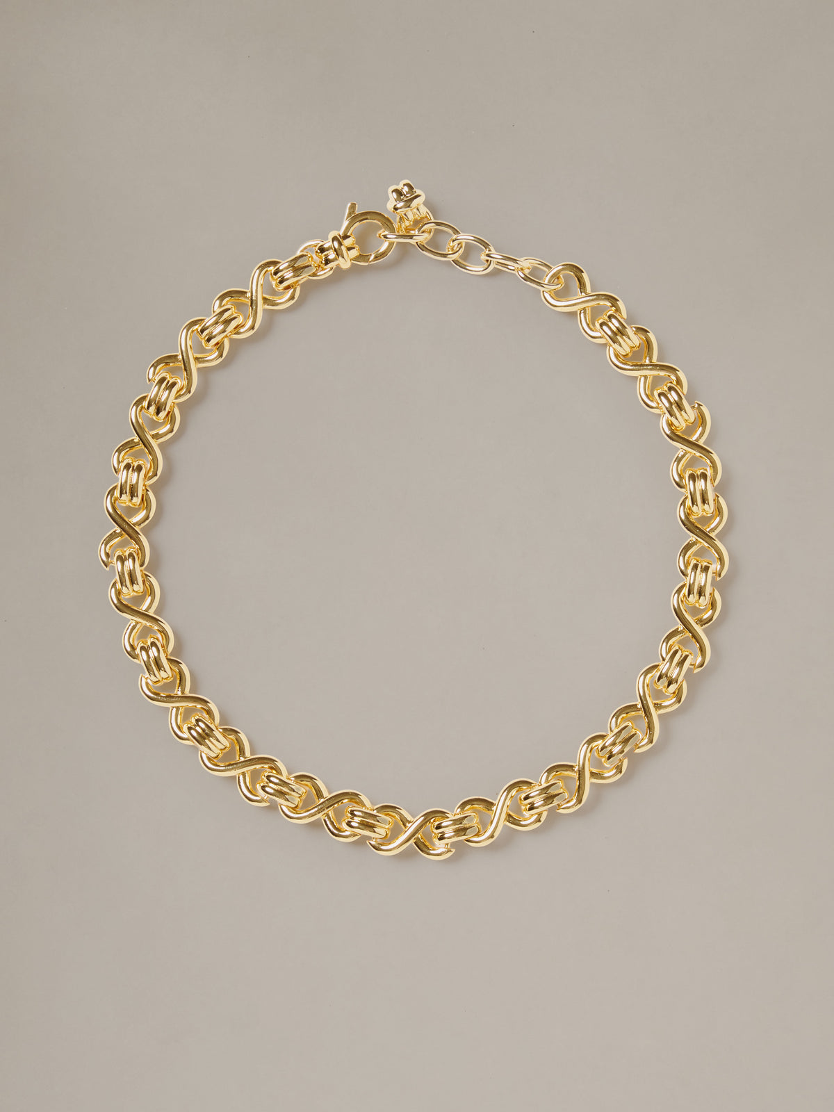 J.McLaughlin Thick Chain Necklace featuring an interwoven gold tone chain and secure clasp for effortlessly stylish timeless appeal.