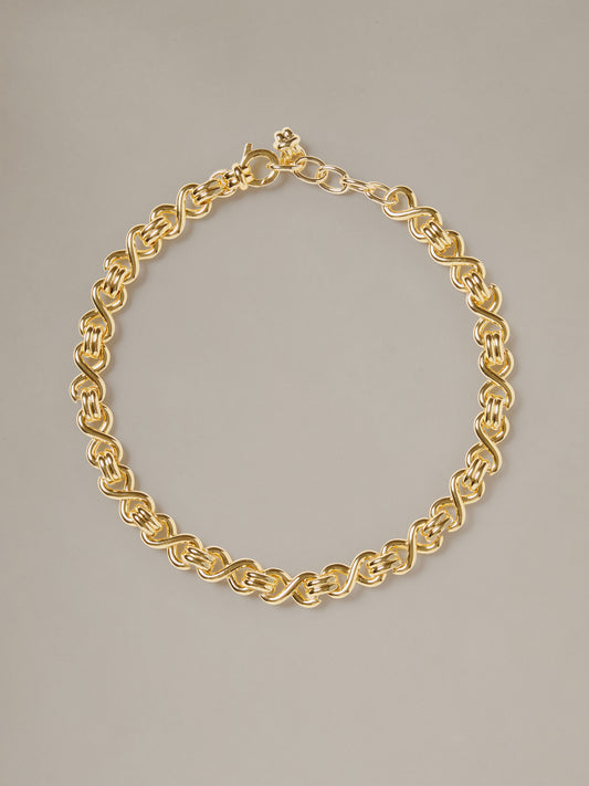 J.McLaughlin Thick Chain Necklace featuring an interwoven gold tone chain and secure clasp for effortlessly stylish timeless appeal.