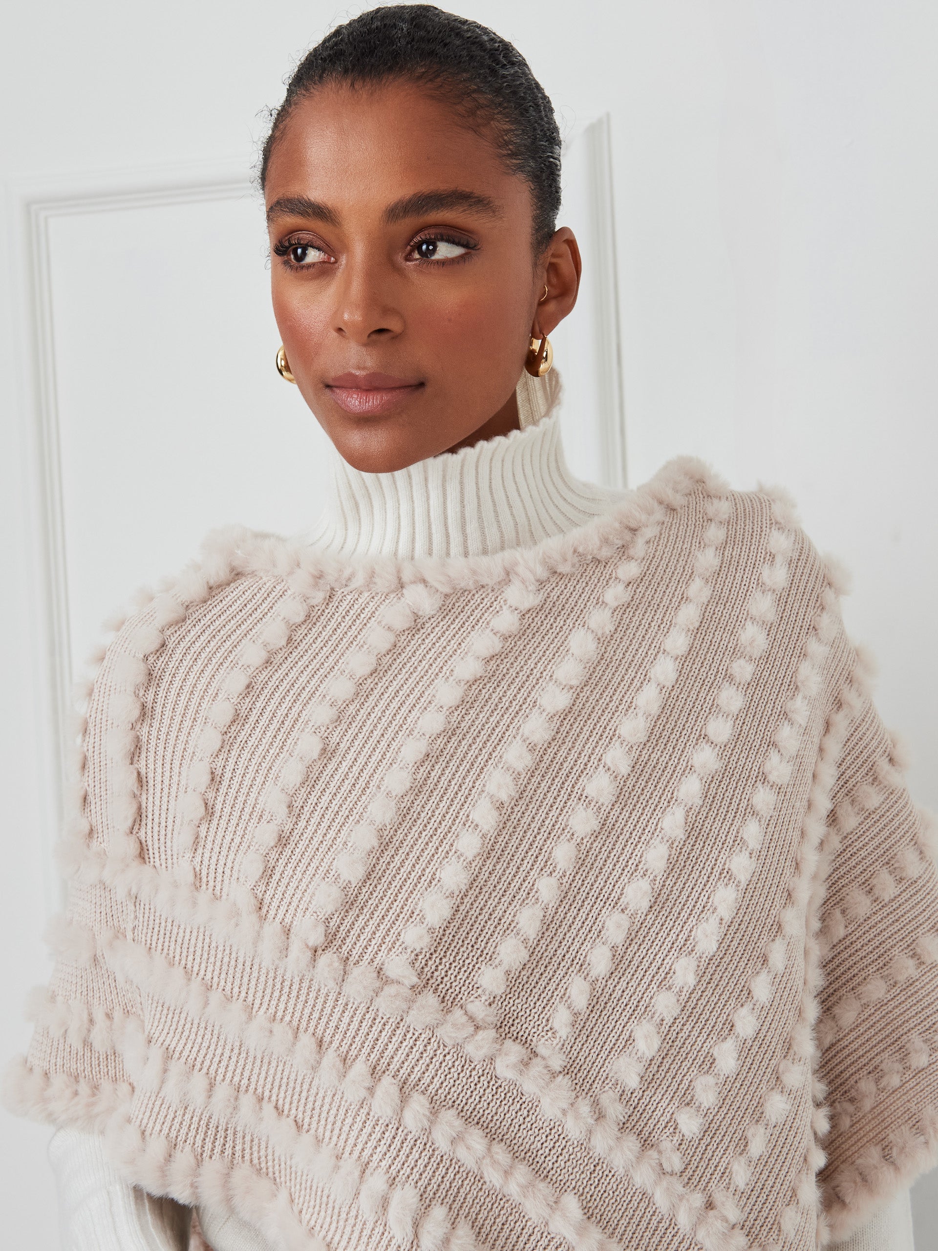 J.McLaughlin Charlie poncho in cream made with faux fur. 