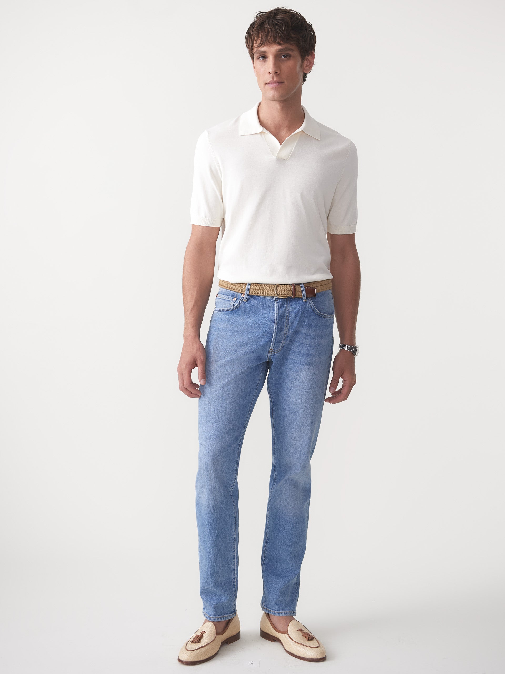 Model wearing J.McLaughlin Cillian sweater polo in egret white made with cotton.