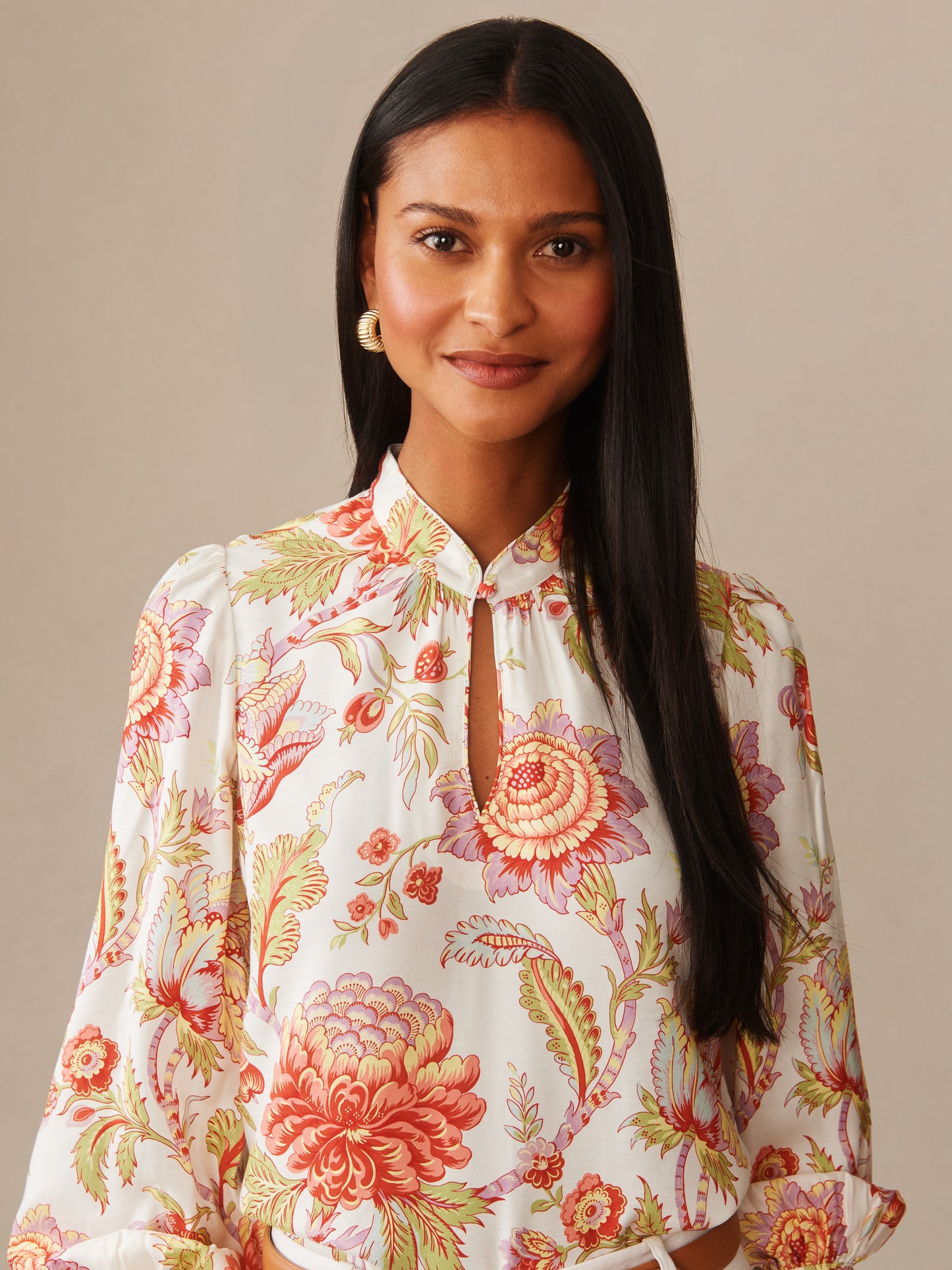Woman wearing a Maeve Silk Blend Blouse in Cerulean Garden by J.McLaughlin, featuring an effortlessly stylish floral pattern with enduring designs and innovative fabrics, embodying a legacy of timeless fashion. A destination for defining style. Life, Well-Lived.