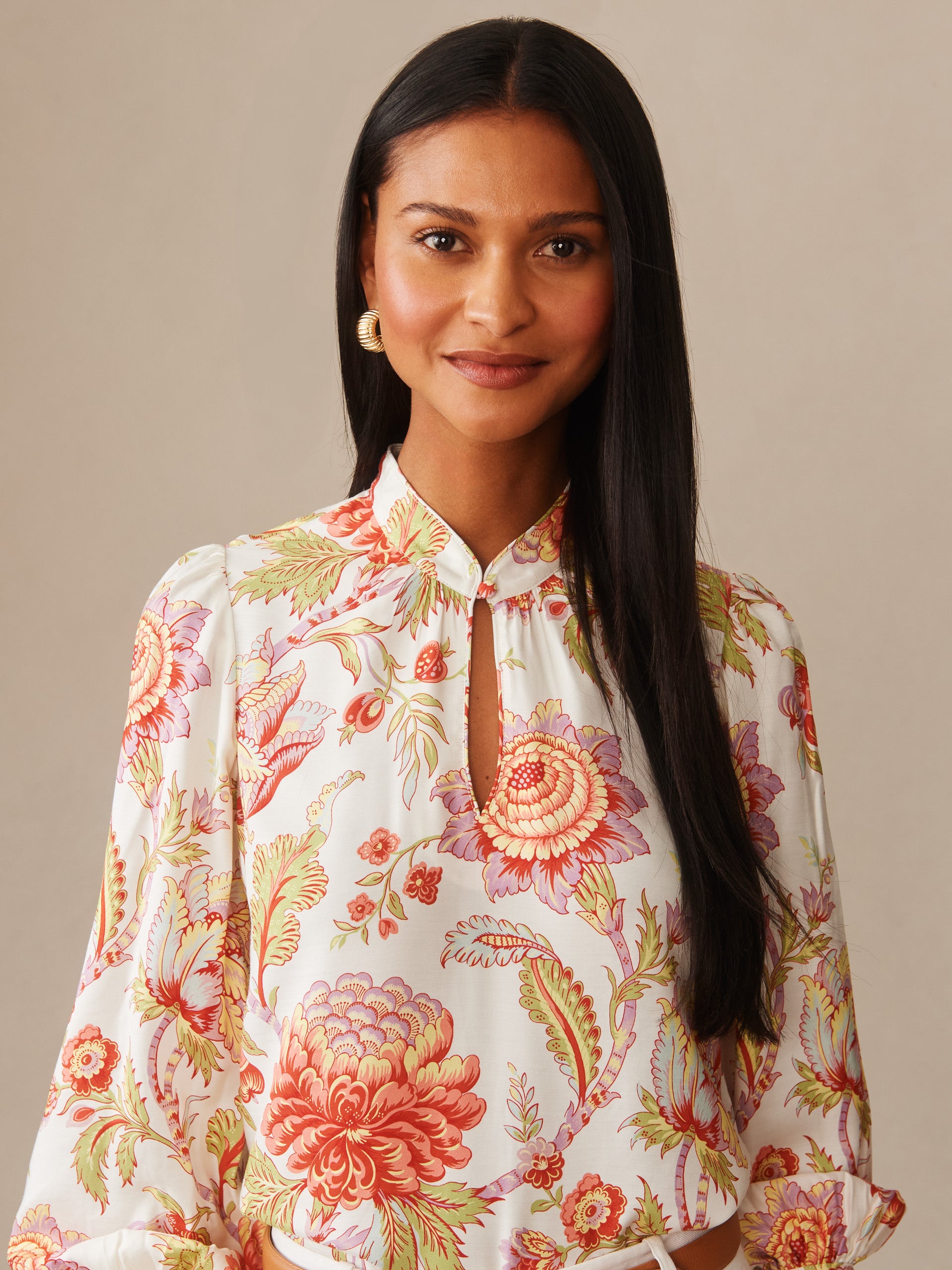 Woman wearing a Maeve Silk Blend Blouse in Cerulean Garden by J.McLaughlin, featuring an effortlessly stylish floral pattern with enduring designs and innovative fabrics, embodying a legacy of timeless fashion. A destination for defining style. Life, Well-Lived.