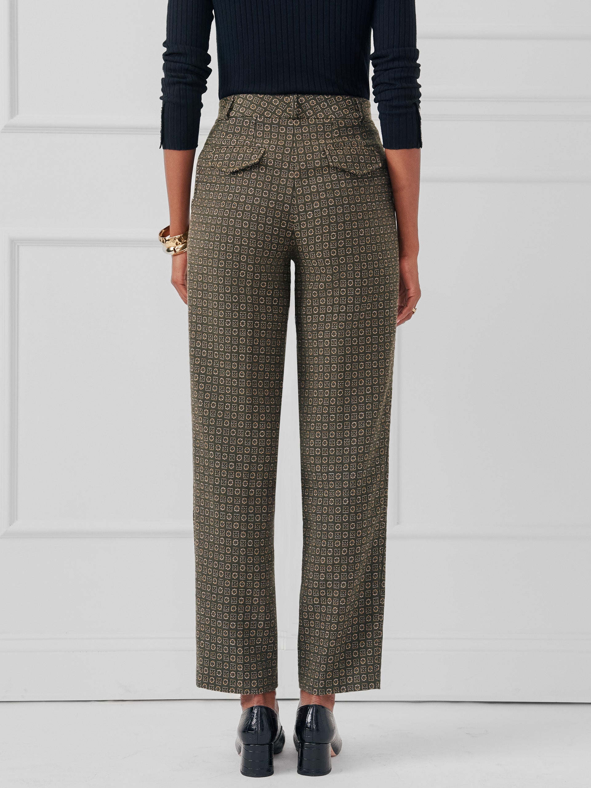 Model wearing J.McLaughlin Colleen pants in green made with poly/cotton.
