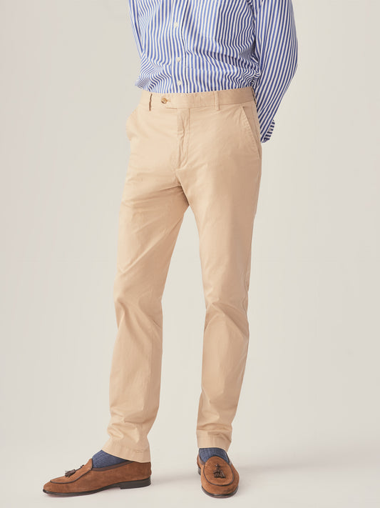 Model wearing J.McLaughlin Taylor pants in khaki made with cotton/spandex.