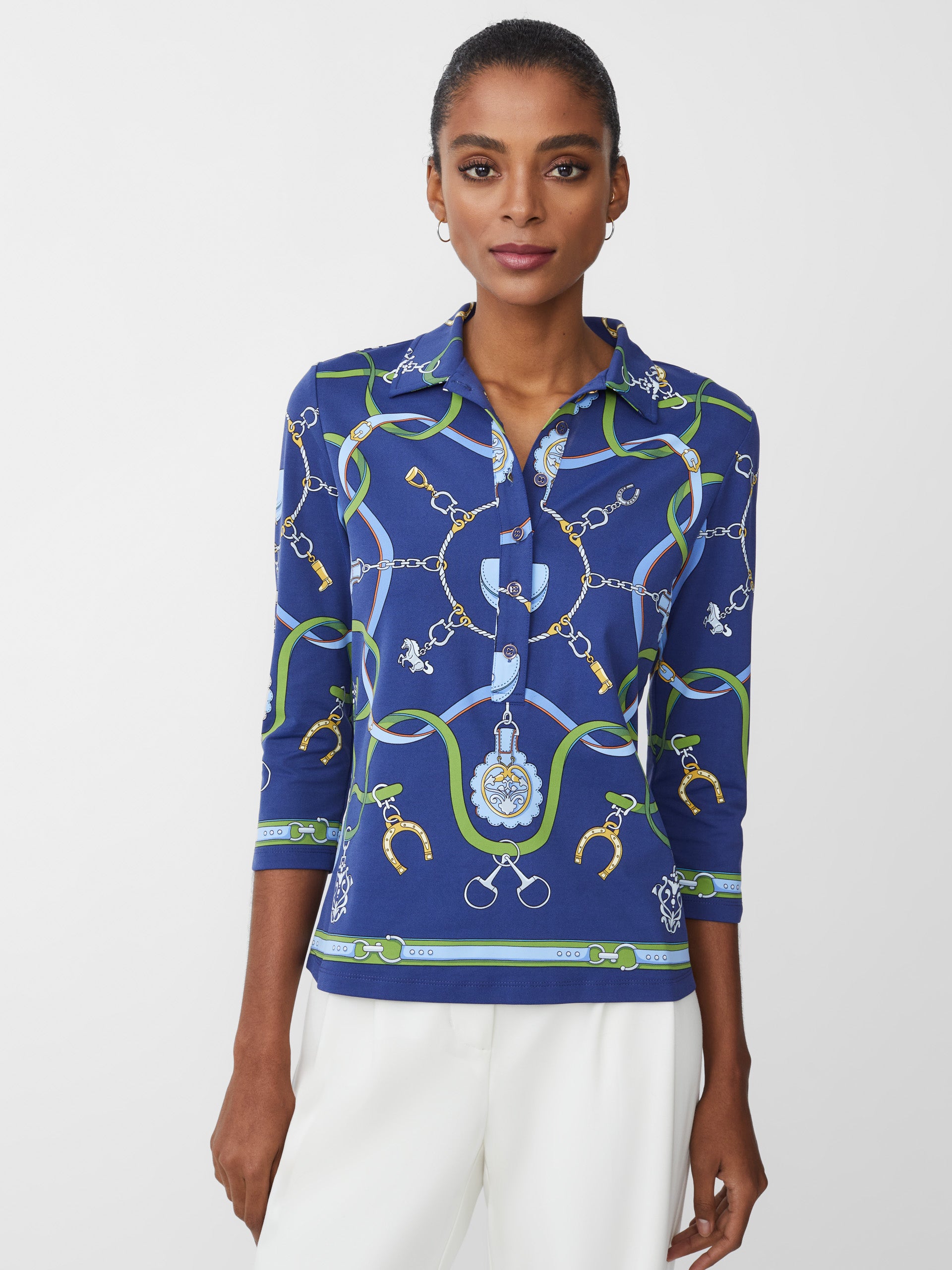 Model wearing J.McLaughlin Court 3/4 sleeve polo in navy/green/blue made with Catalina cloth.