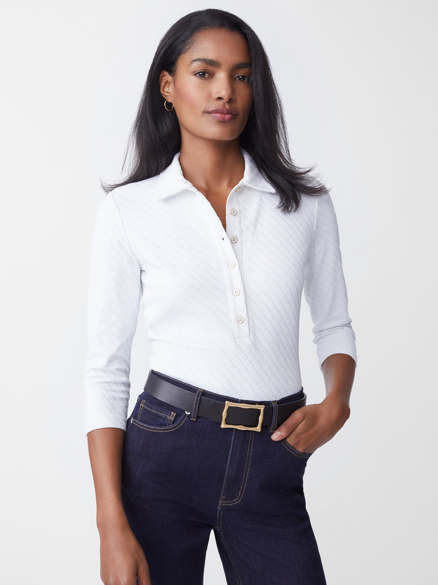 Model wears J.McLaughlin Court 3/4 Sleeve Polo in white made with JMC Catalina Cloth fabric.