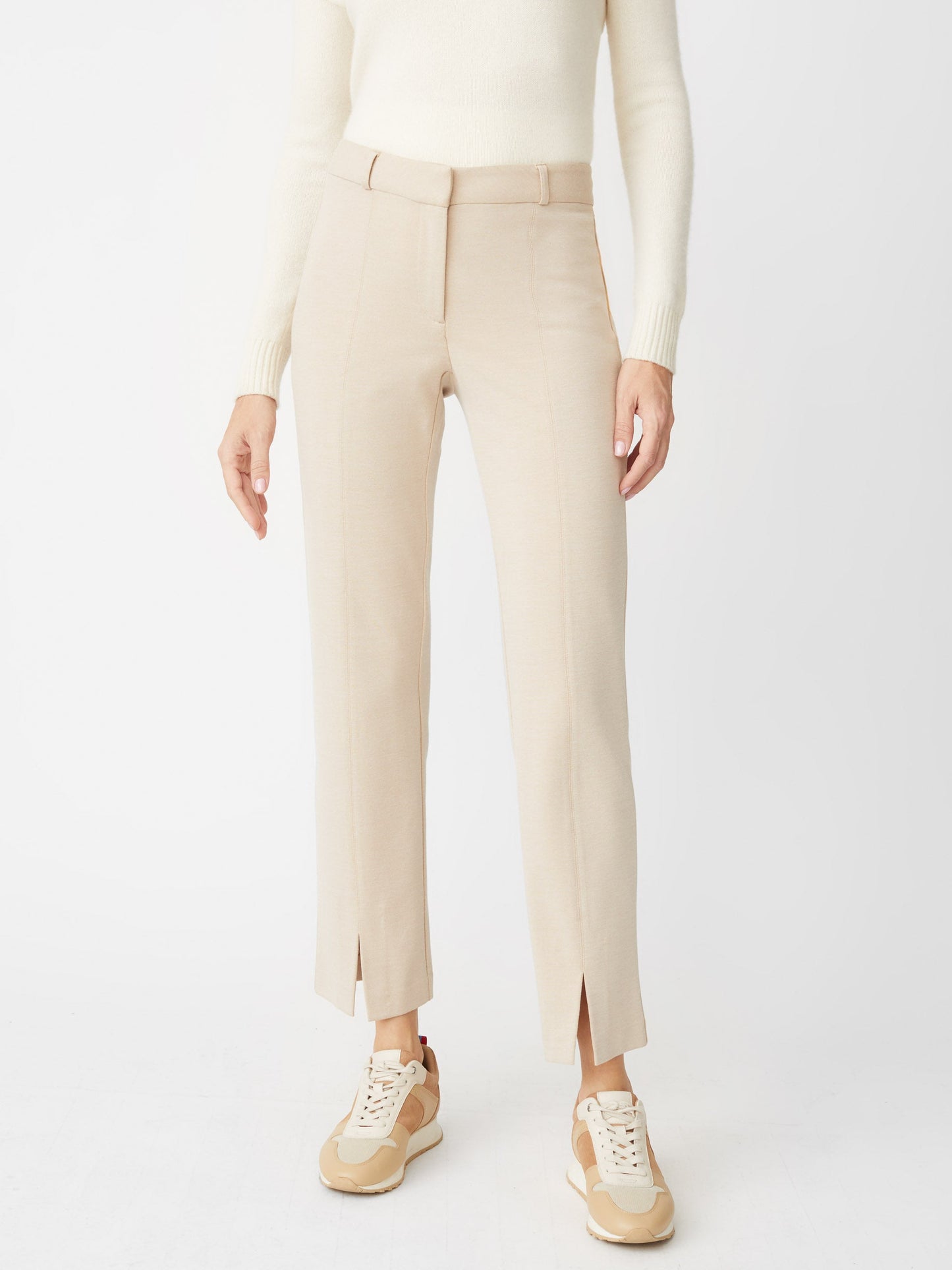 Model wearing J.McLaughlin Deanne pants in heather sand made with Bainbridge fabric.