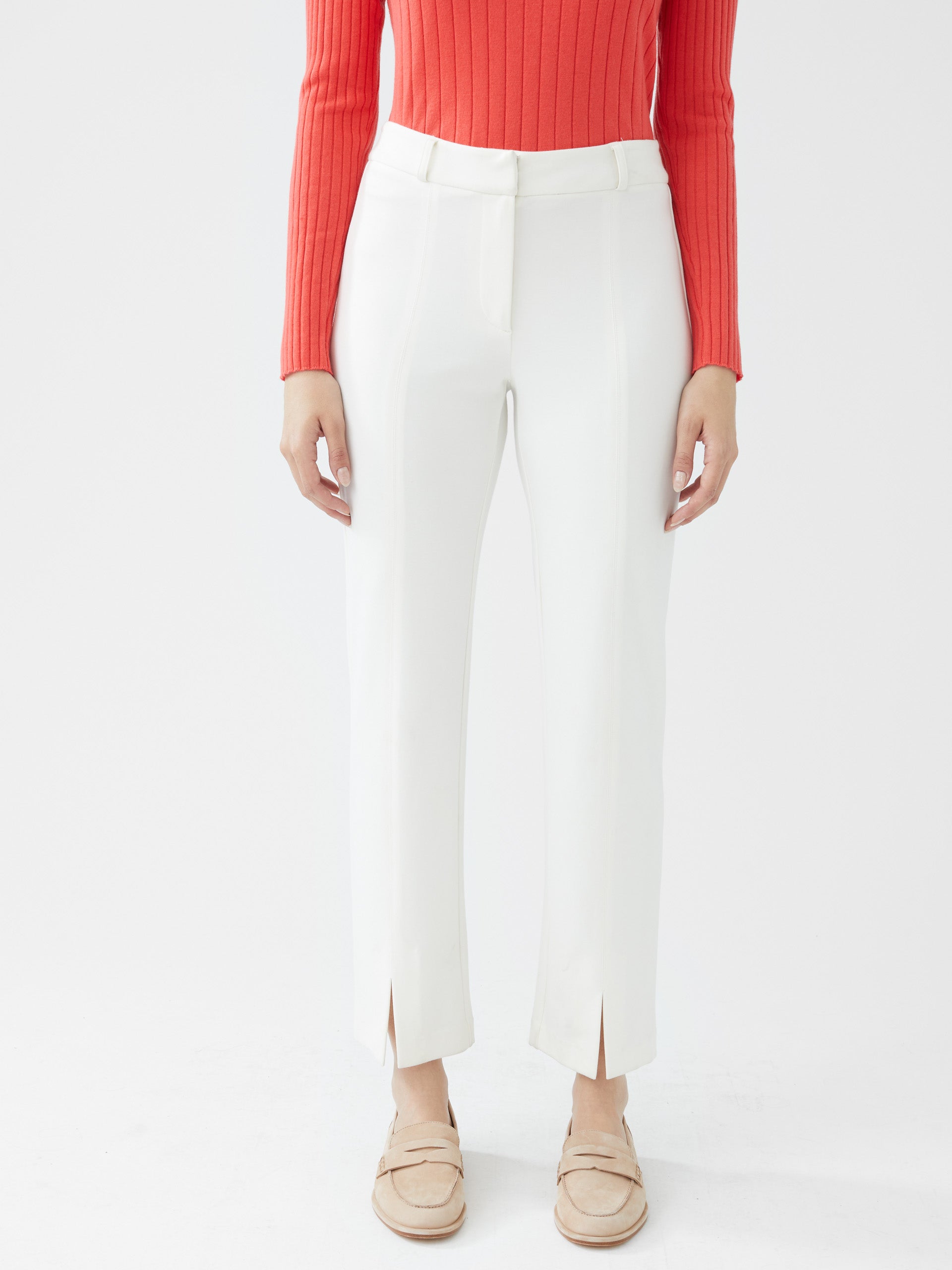 Model wearing J.McLaughlin Deanne pants in ivory made with Bainbridge fabric.