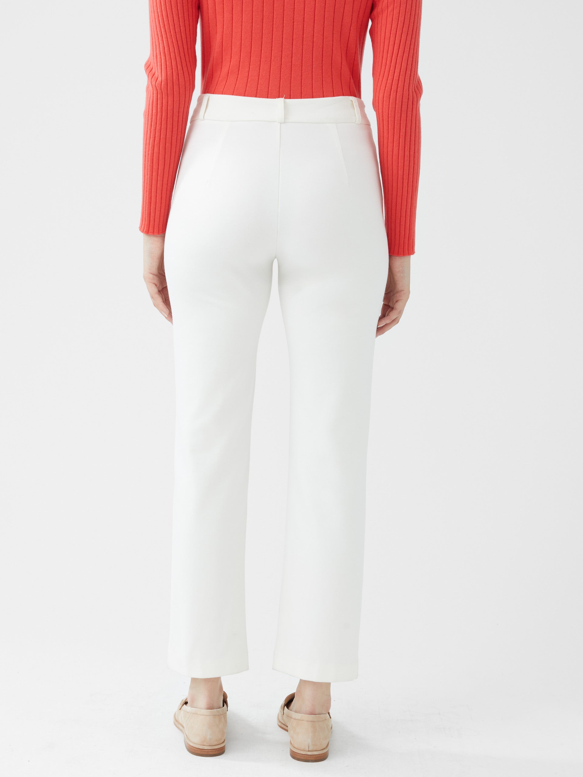 Model wearing J.McLaughlin Deanne pants in ivory made with Bainbridge fabric.