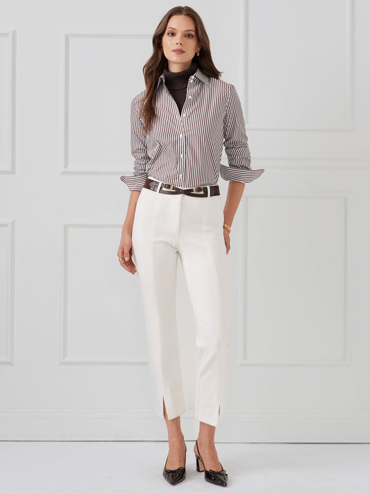 Model wearing J.McLaughlin Deanne pants in ivory made with Bainbridge fabric.
