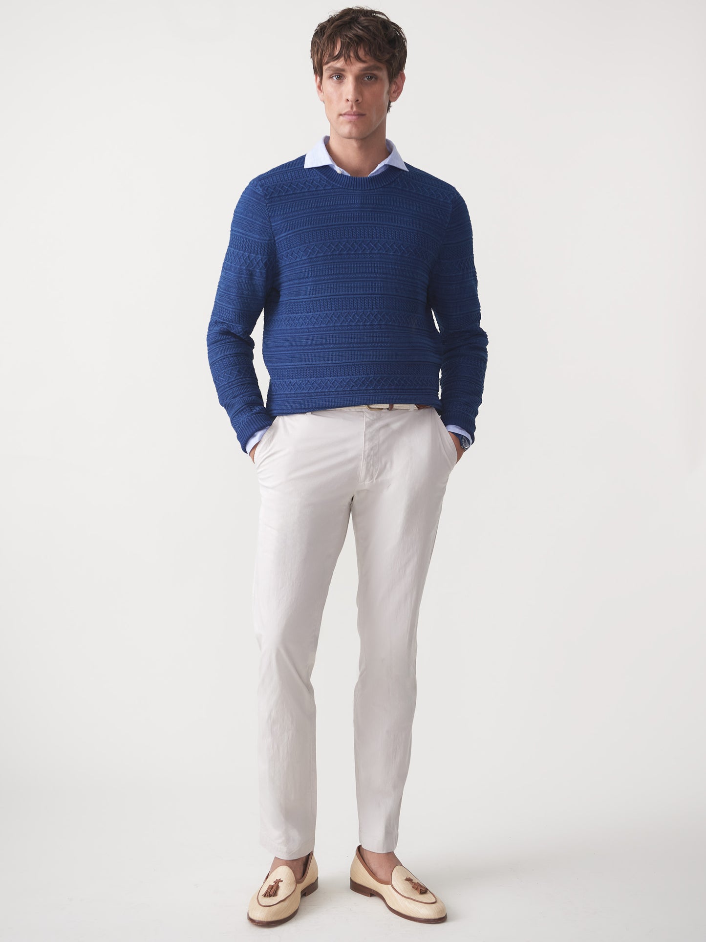 Model wearing J.McLaughlin Dennis sweater in indigo made with cotton.