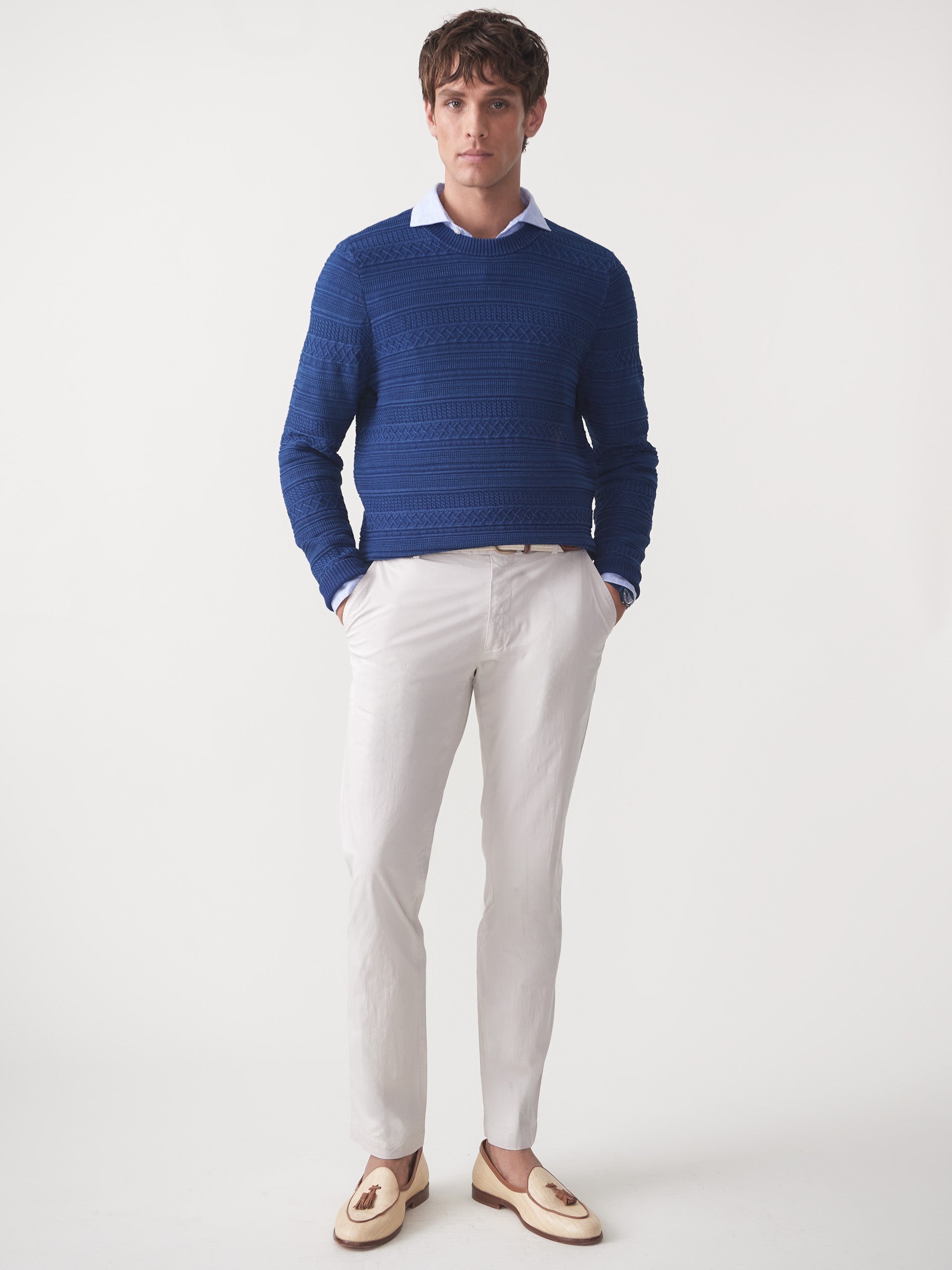 Model wearing J.McLaughlin Dennis sweater in indigo made with cotton.