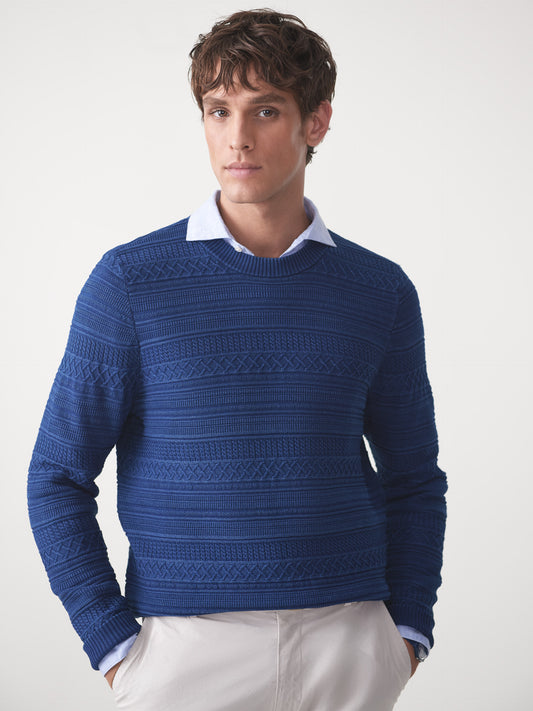 Model wearing J.McLaughlin Dennis sweater in indigo made with cotton.