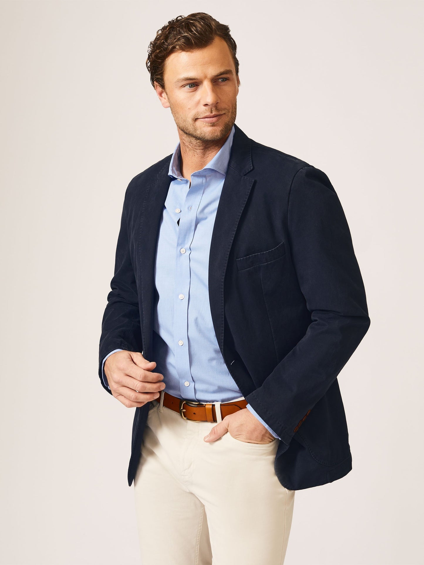 Model wearing J.McLaughlin Lisbon blazer in navy made with cotton.
