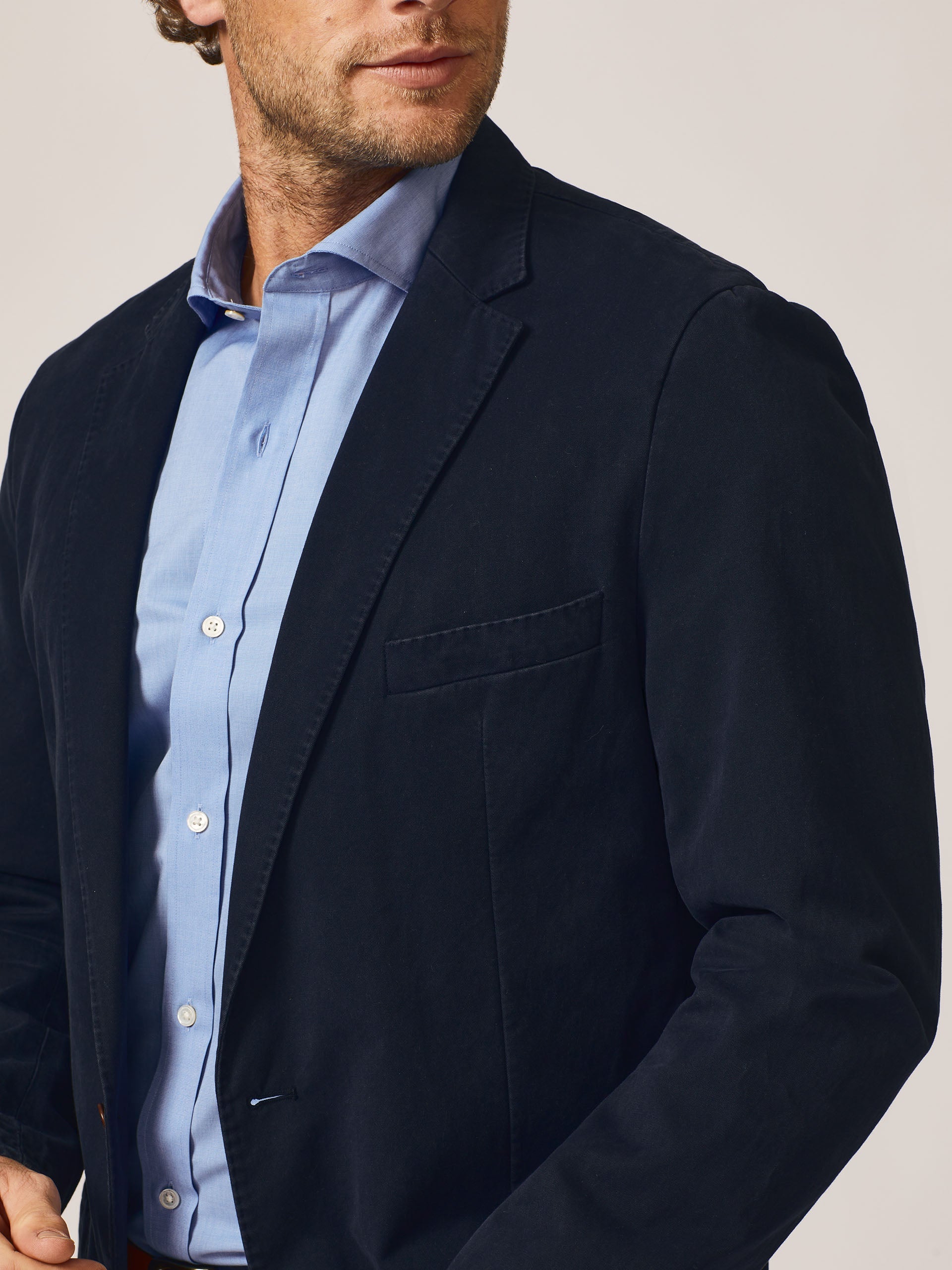 Model wearing J.McLaughlin Lisbon blazer in navy made with cotton.