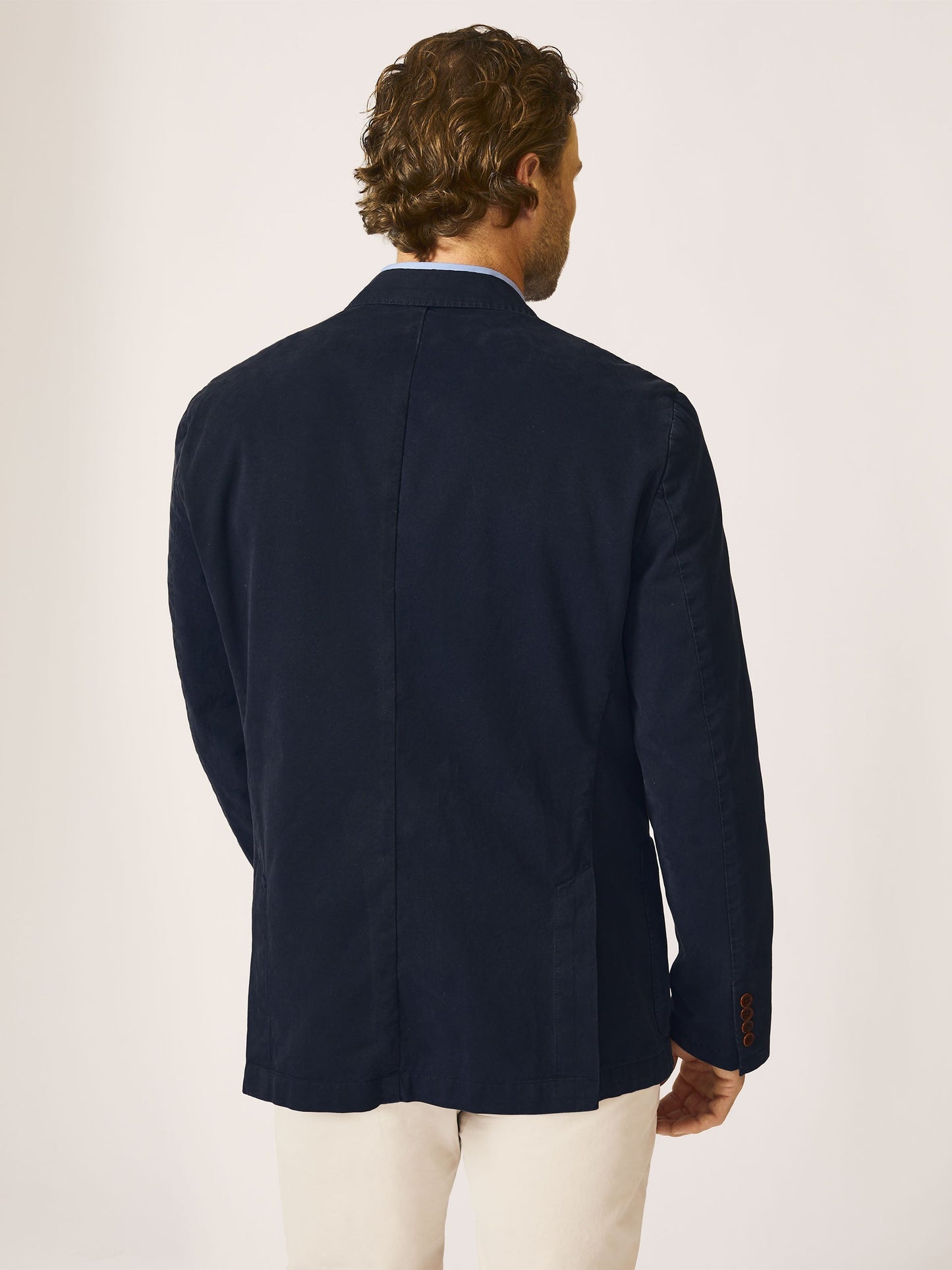 Model wearing J.McLaughlin Lisbon blazer in navy made with cotton.