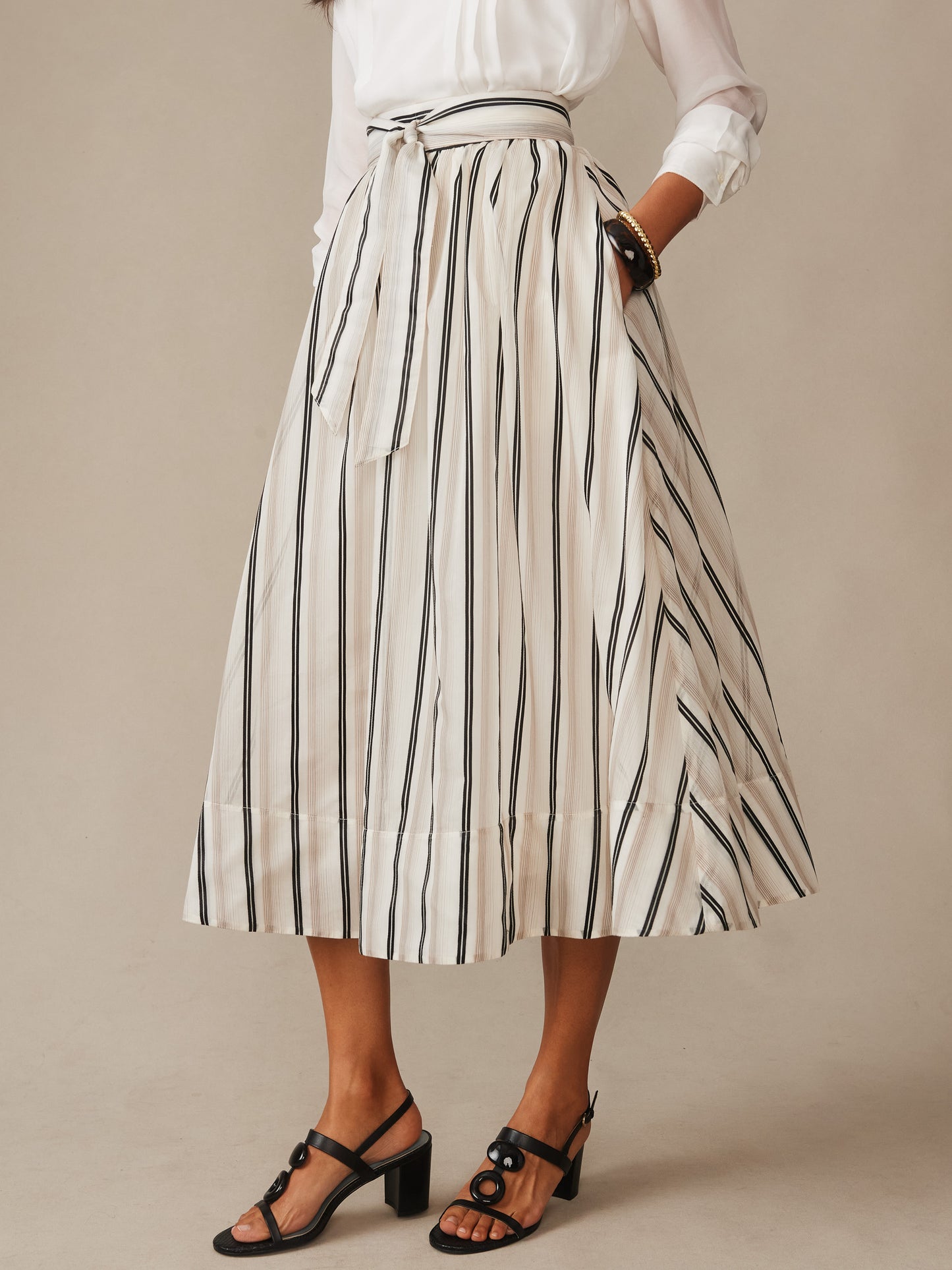 Elenia Skirt in Stripe from J.McLaughlin features effortlessly stylish vertical stripes and a tied waist for a classic, enduring design in innovative fabrics, perfect for Life, Well-Lived.