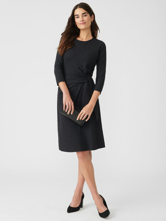 Model wearing J.McLaughlin Elora dress in black made with Catalina cloth.