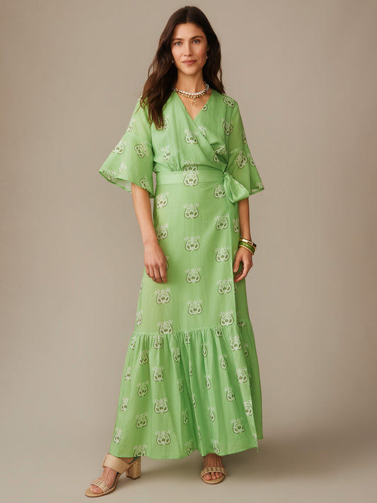 Woman wearing an effortlessly stylish Emily Wrap Dress in Siesta by J.McLaughlin, featuring enduring designs and innovative fabrics that reflect a legacy of timeless fashion. A destination for defining style. Life, Well-Lived.