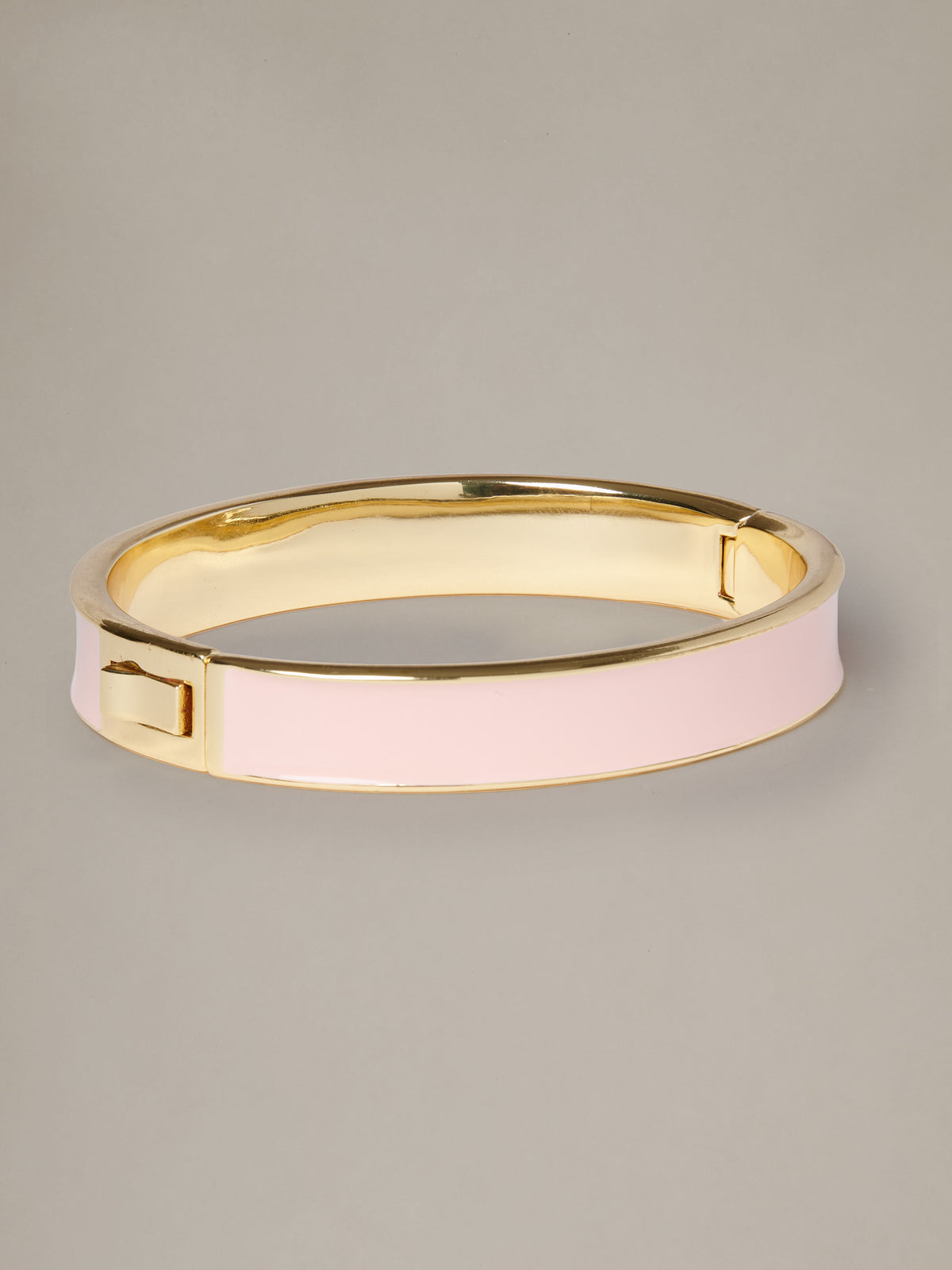 Enamel Hinge Bangle by J.McLaughlin featuring pale pink enamel and a polished gold tone hinge closure on a neutral background