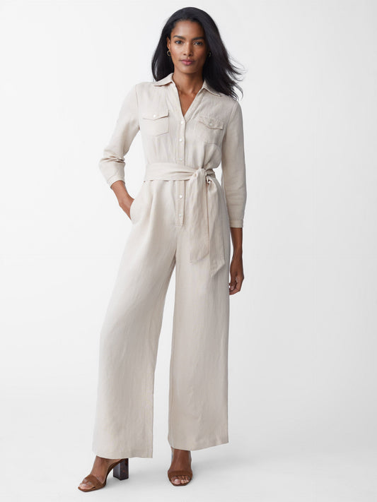 Model wearing J.McLaughlin Ernst jumpsuit in tan made with linen and lyocell.