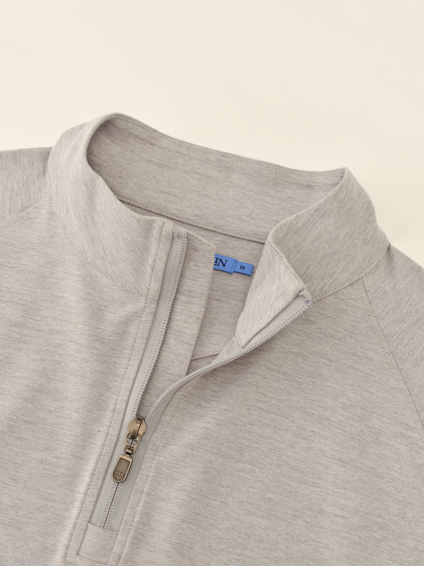J.McLaughlin Featherweight polo in Heather Light Gray made with Polyester.