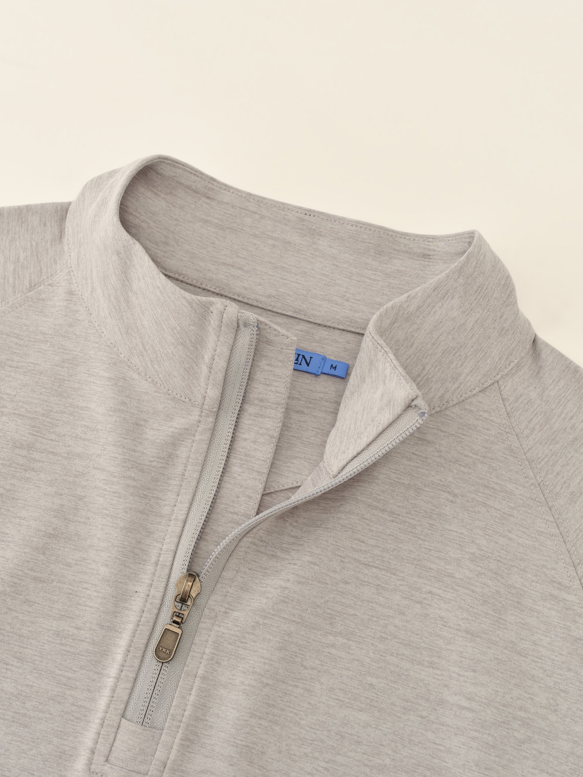 J.McLaughlin Featherweight polo in Heather Light Gray made with Polyester.